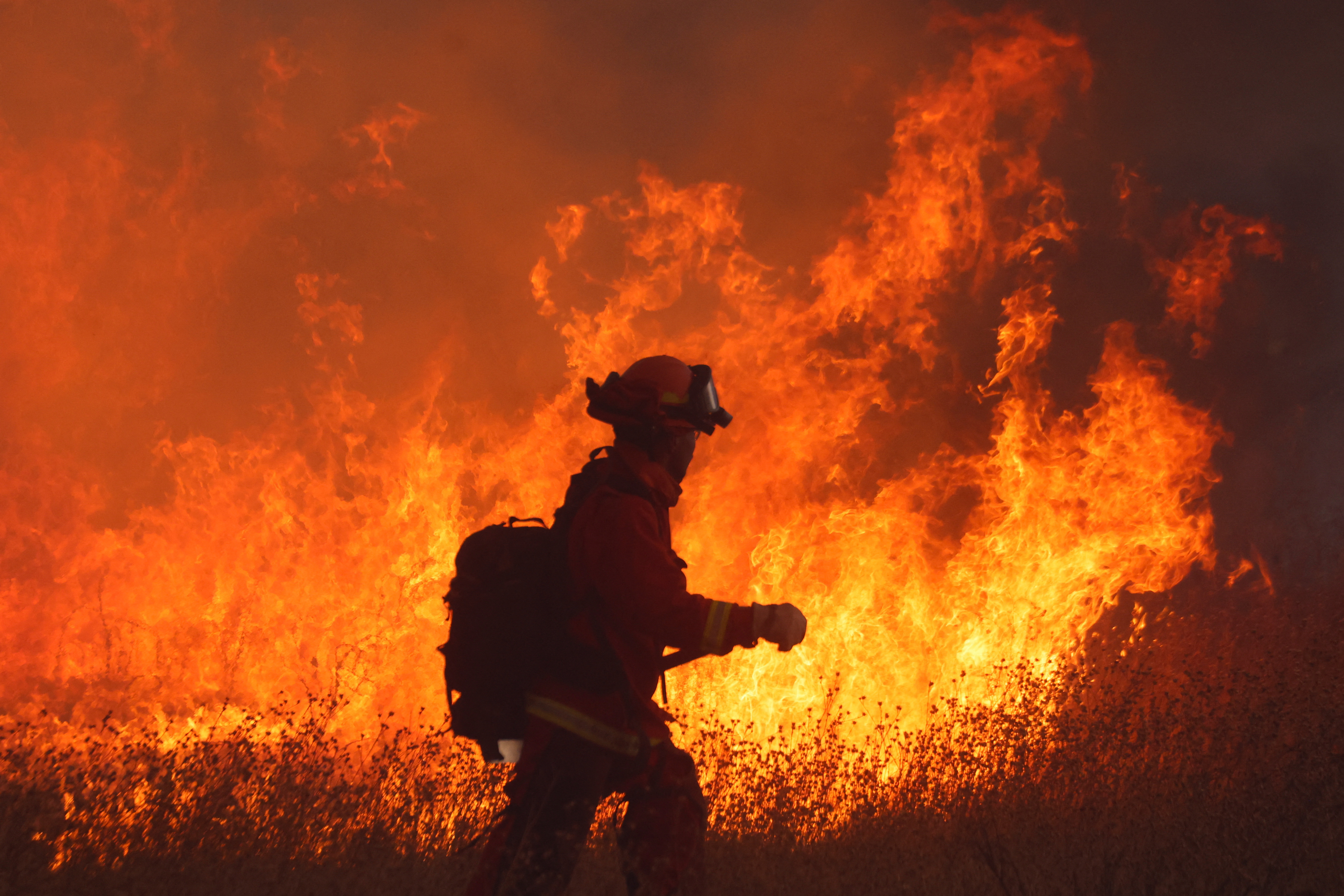 A crew battles the fire as the Hughes Fire burns in Castaic Lake