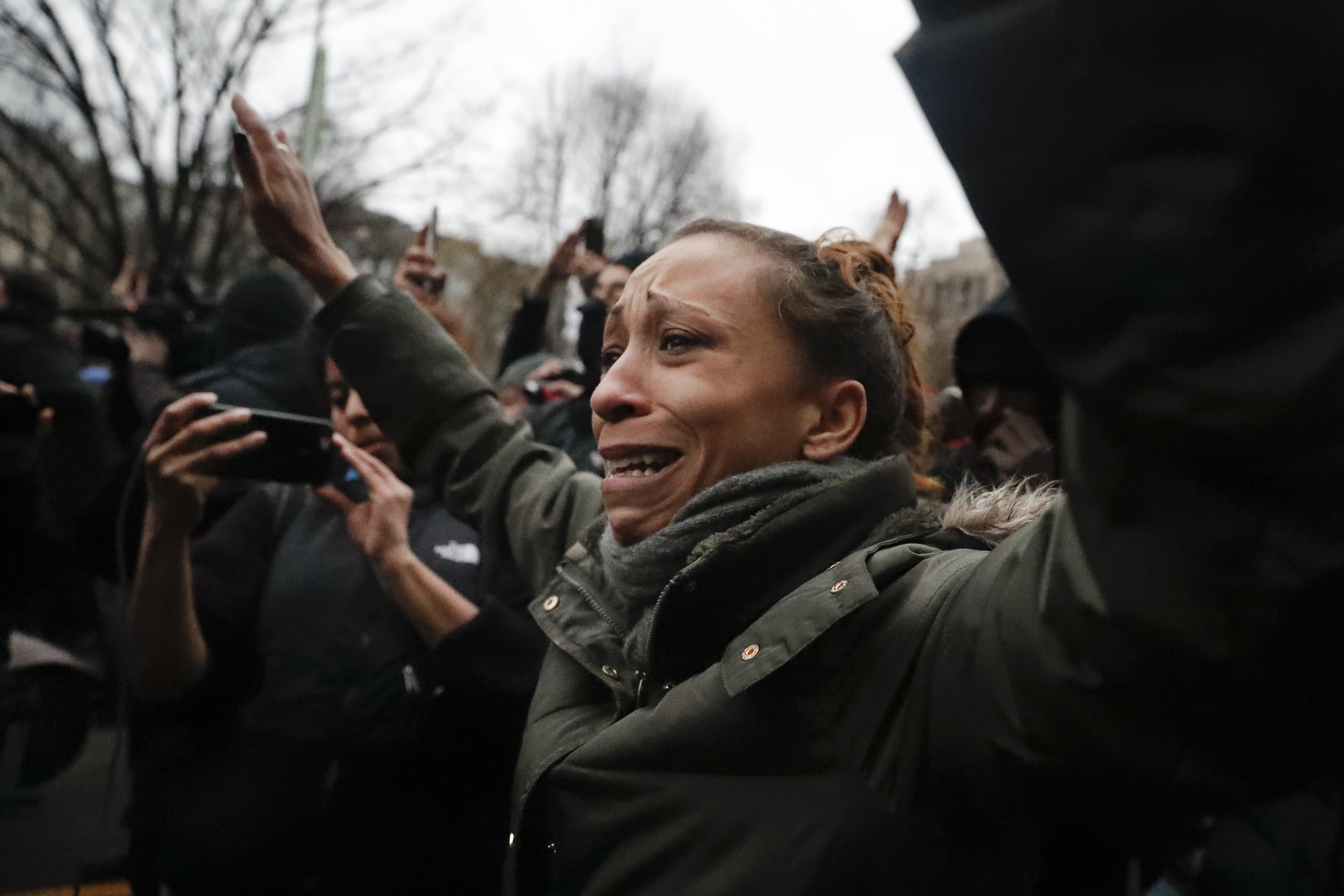A protester cries in downtown Washington, DC, in 2017