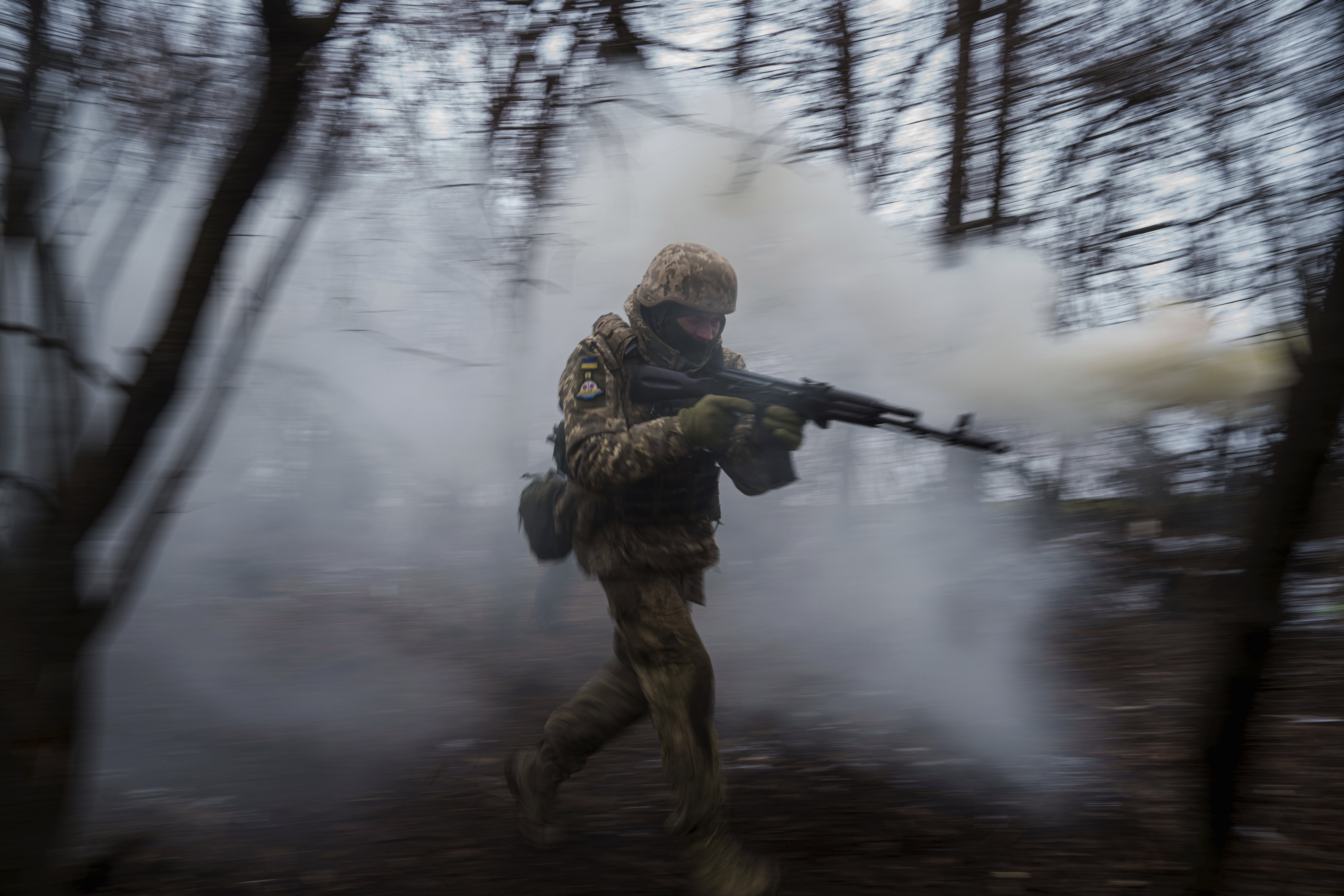 A member of Ukraine's 24th Mechanized brigade trains at the polygon, not far from front-line in the Donetsk region of eastern Ukraine on Tuesday, Jan 21 2022.