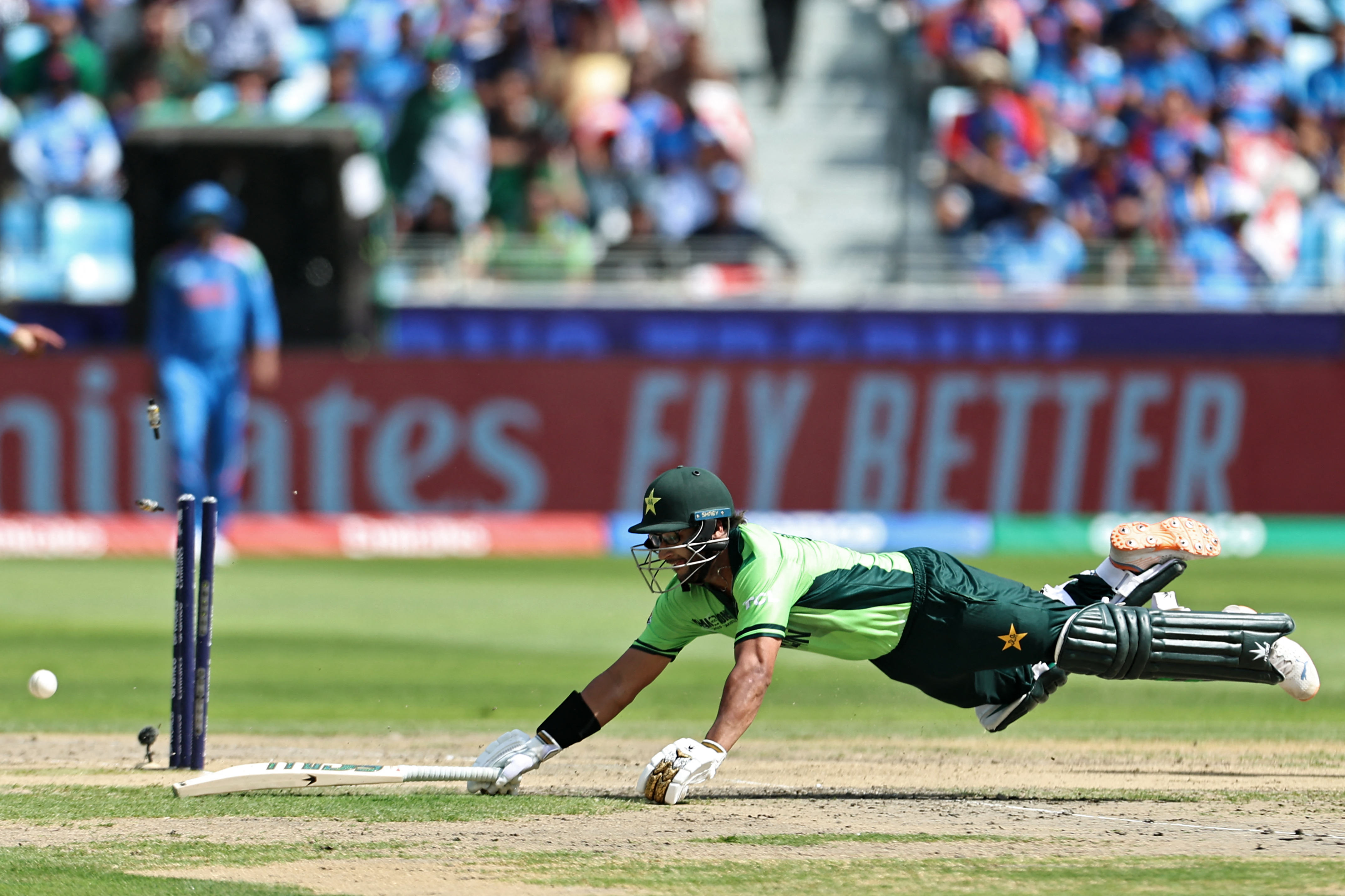 Pakistan's Imam-ul-Haq is run-out by India's Axar Patel during the ICC Champions Trophy one-day international (ODI) cricket match between Pakistan and India at the Dubai International Stadium in Dubai on February 23, 2025. (Photo by FADEL SENNA / AFP)