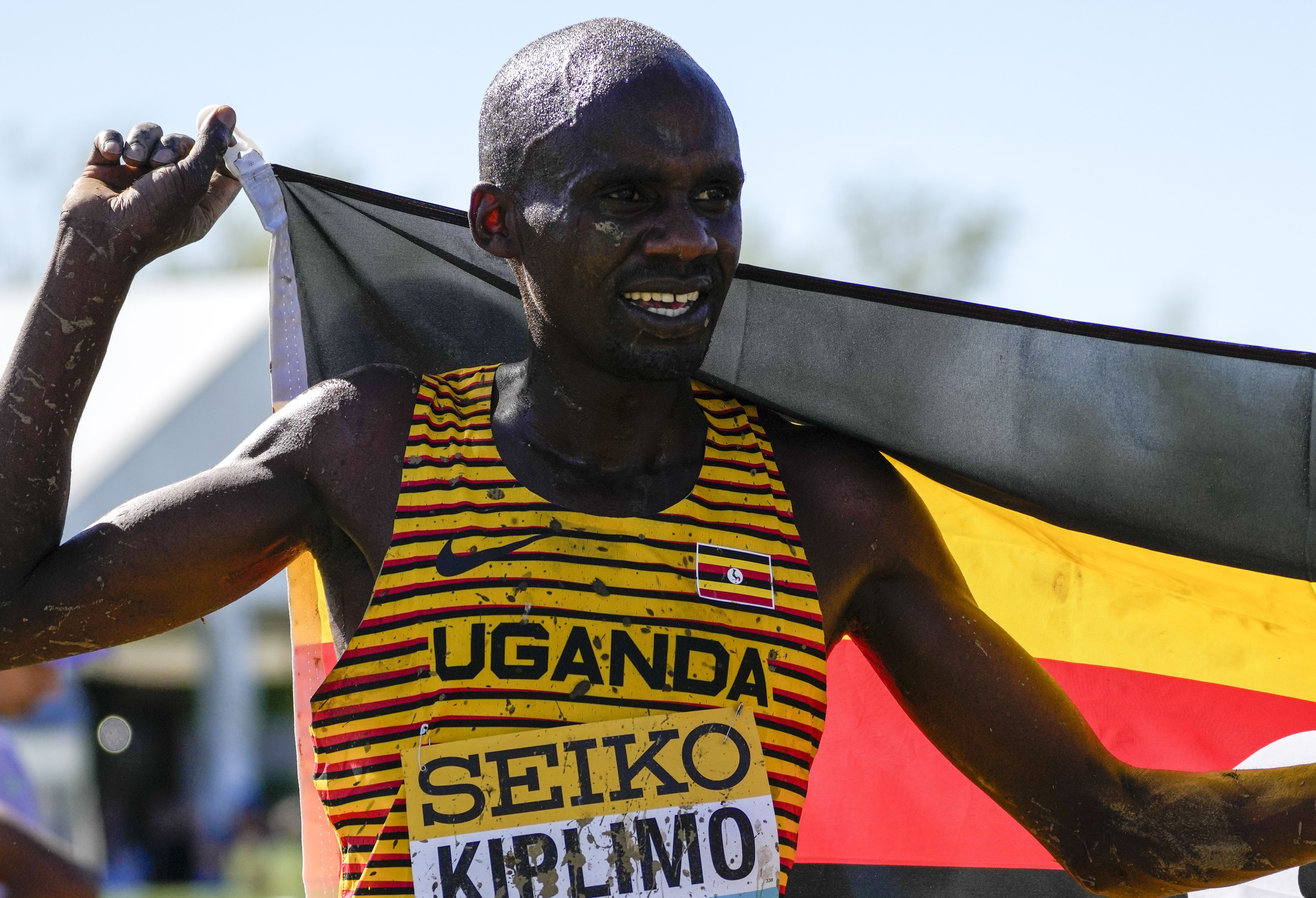 Jacob Kiplimo of Uganda celebrates as he won the men's senior race during the World Athletics Cross Country Championships in Belgrade, Serbia, Saturday, March 30, 2024. (AP Photo/Darko Vojinovic)