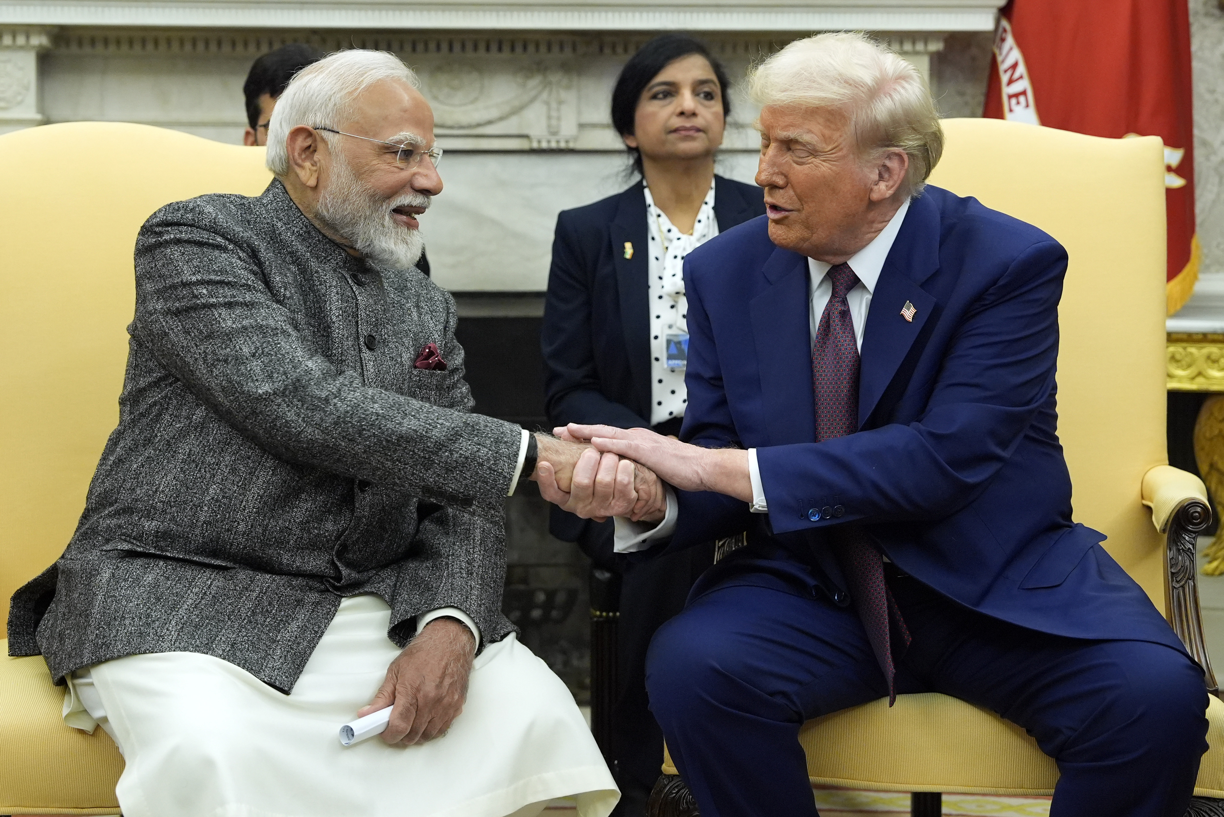 Donald Trump shakes hands with Narendra Modi