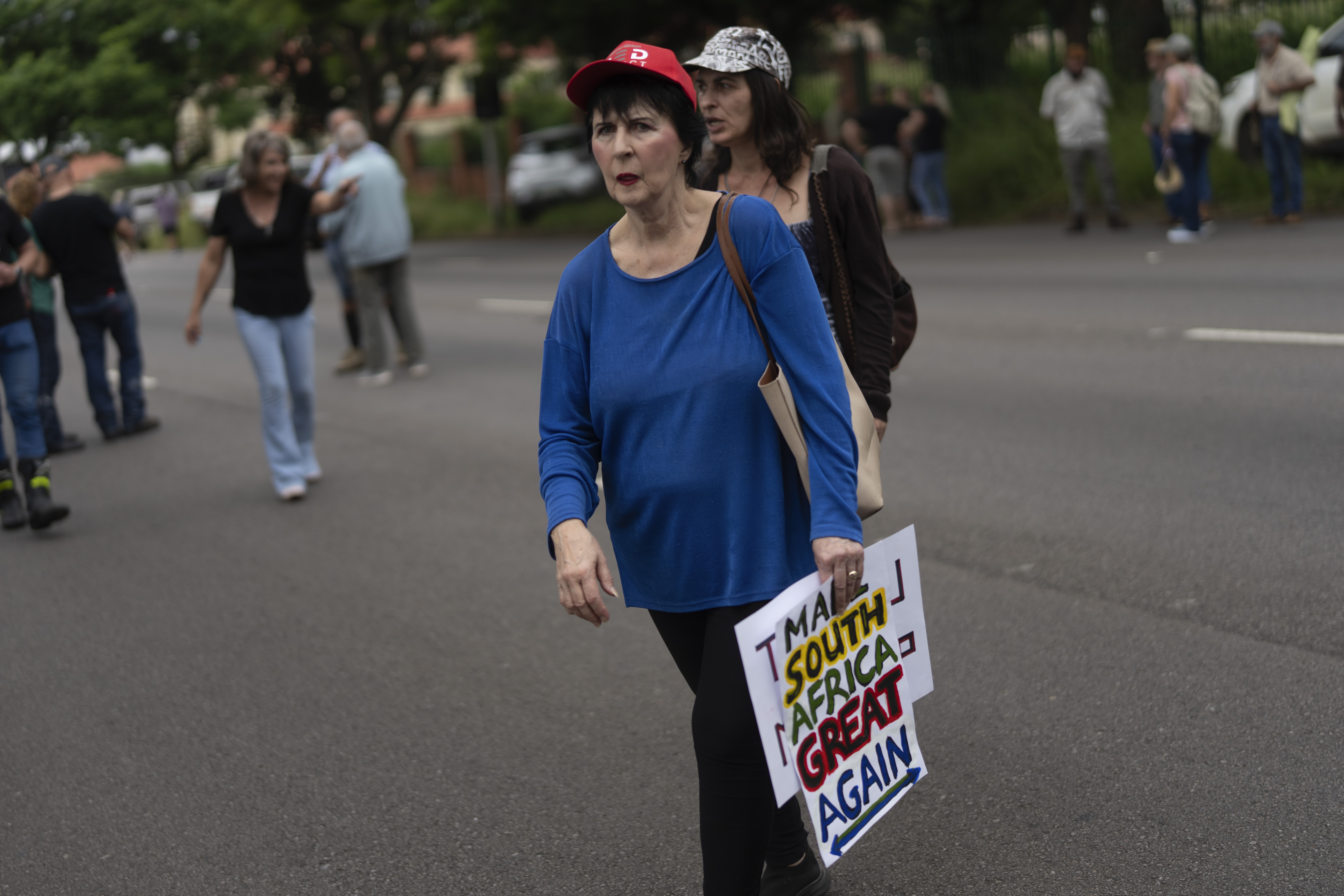White South Africans demonstrate in support of U.S. President Donald Trump in front of the U.S. embassy in Pretoria, South Africa [File: Jerome Delay/AP]