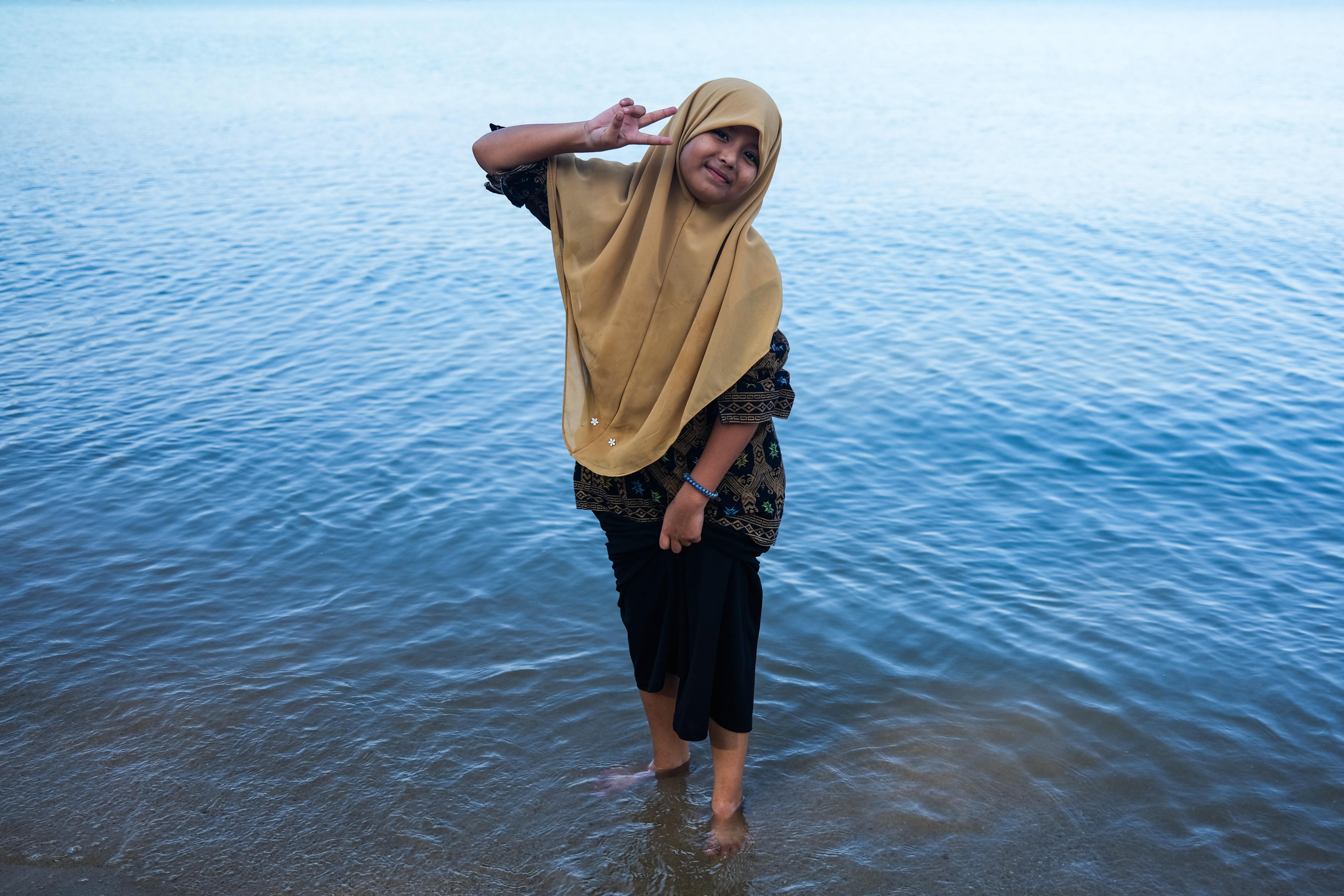 Rohingya children in Malaysia overcome fear to enjoy a day at the beach