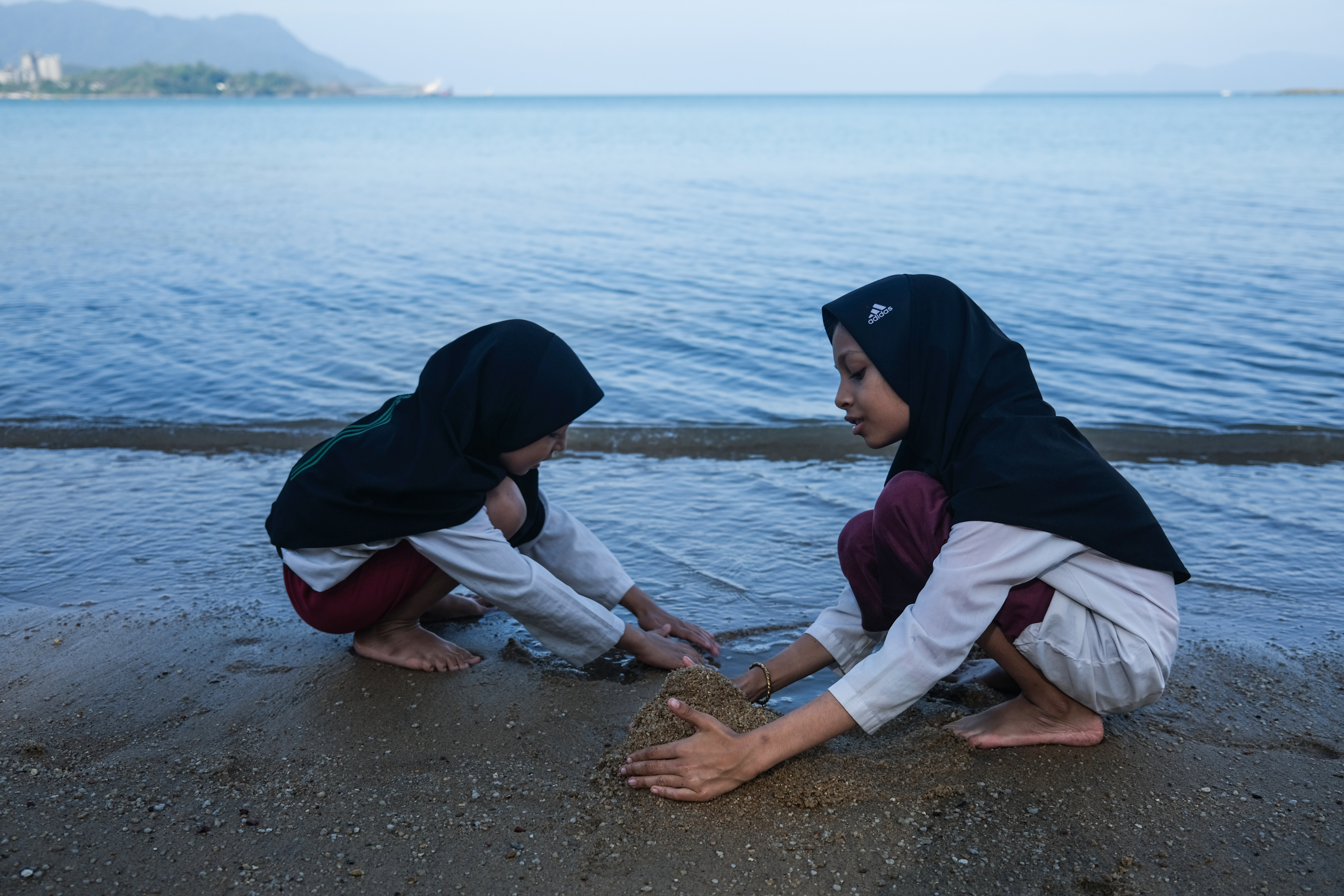 Rohingya children in Malaysia overcome fear to enjoy a day at the beach