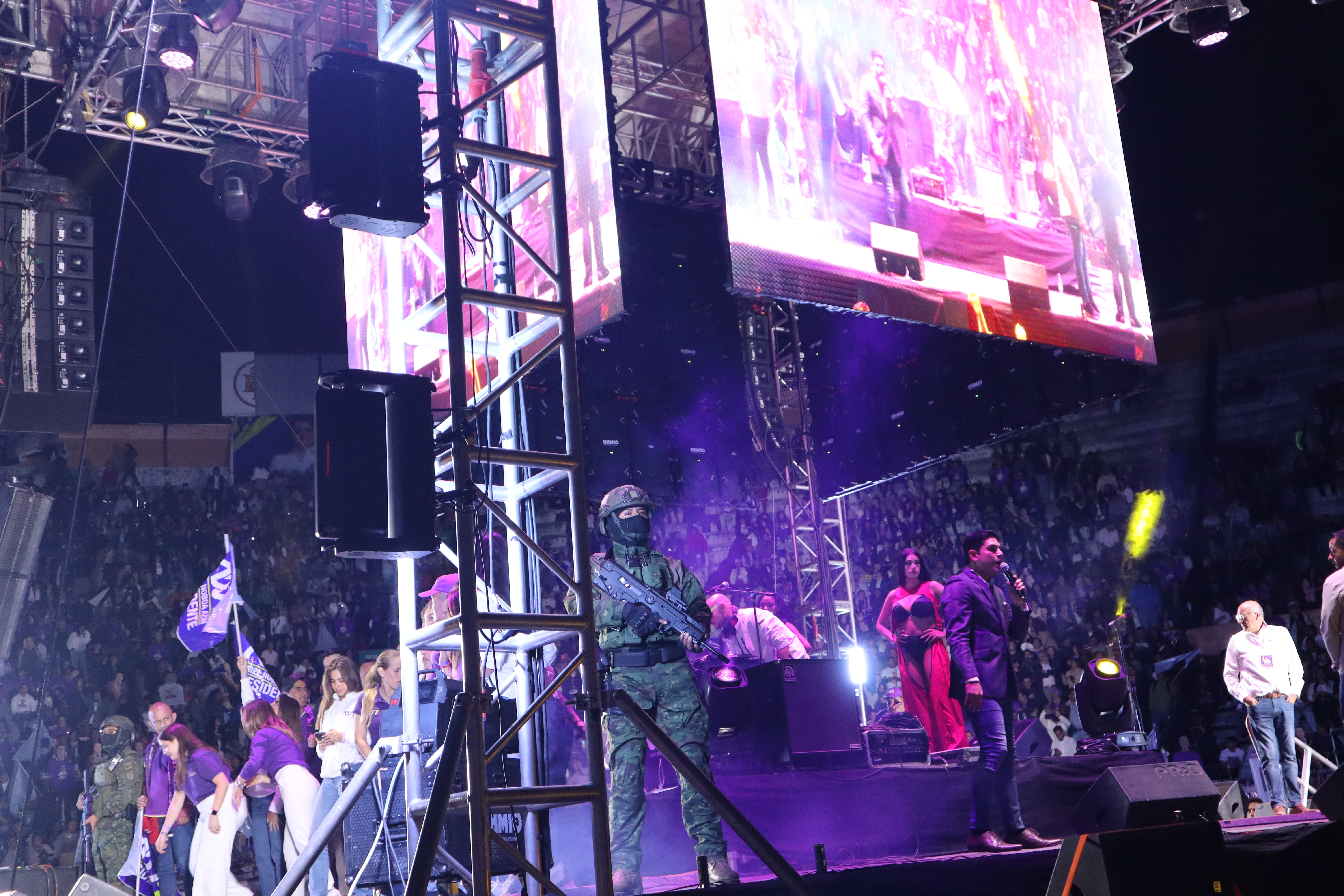 Soldiers stand on stage at Daniel Noboa's final campaign rally in 2025