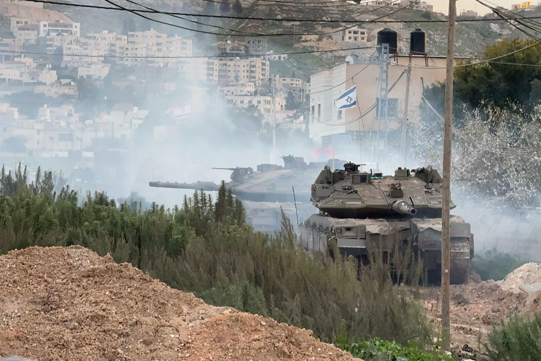 Tanks, which rolled into Jenin early Monday, are stationed in Al-Jabariyat neighbourhood, with a good view of the refugee camp.