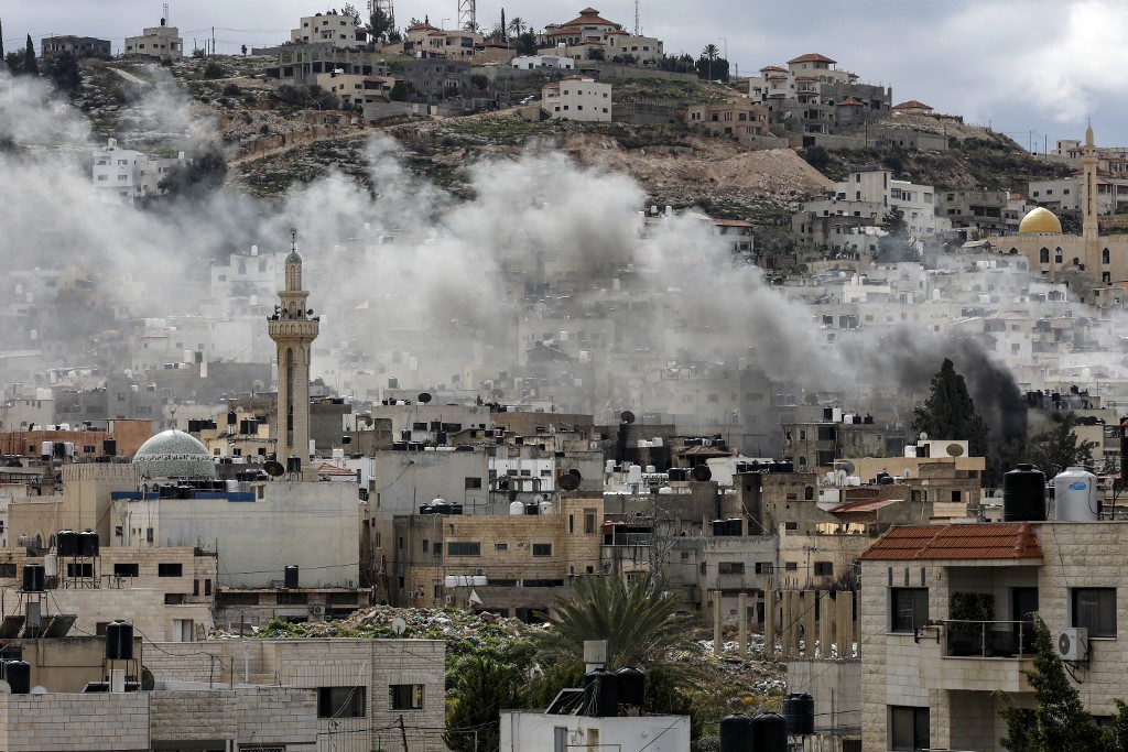 Smoke billows after an explosion over the Jenin camp for Palestinian refugees in the occupied West Bank.