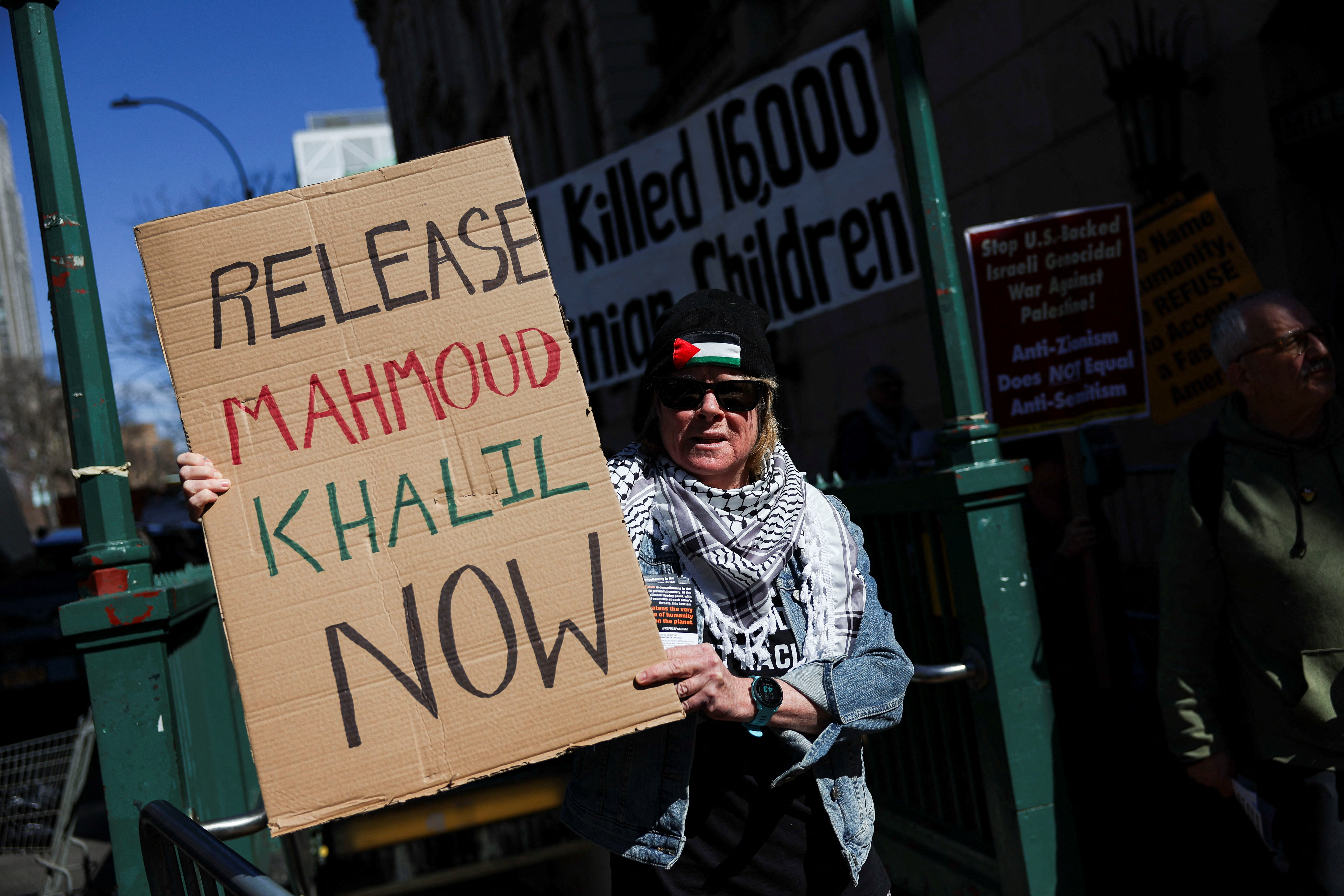 A person holds a sign during a protest following the arrest by US. immigration agents of student protester Mahmoud Khalil at Columbia University