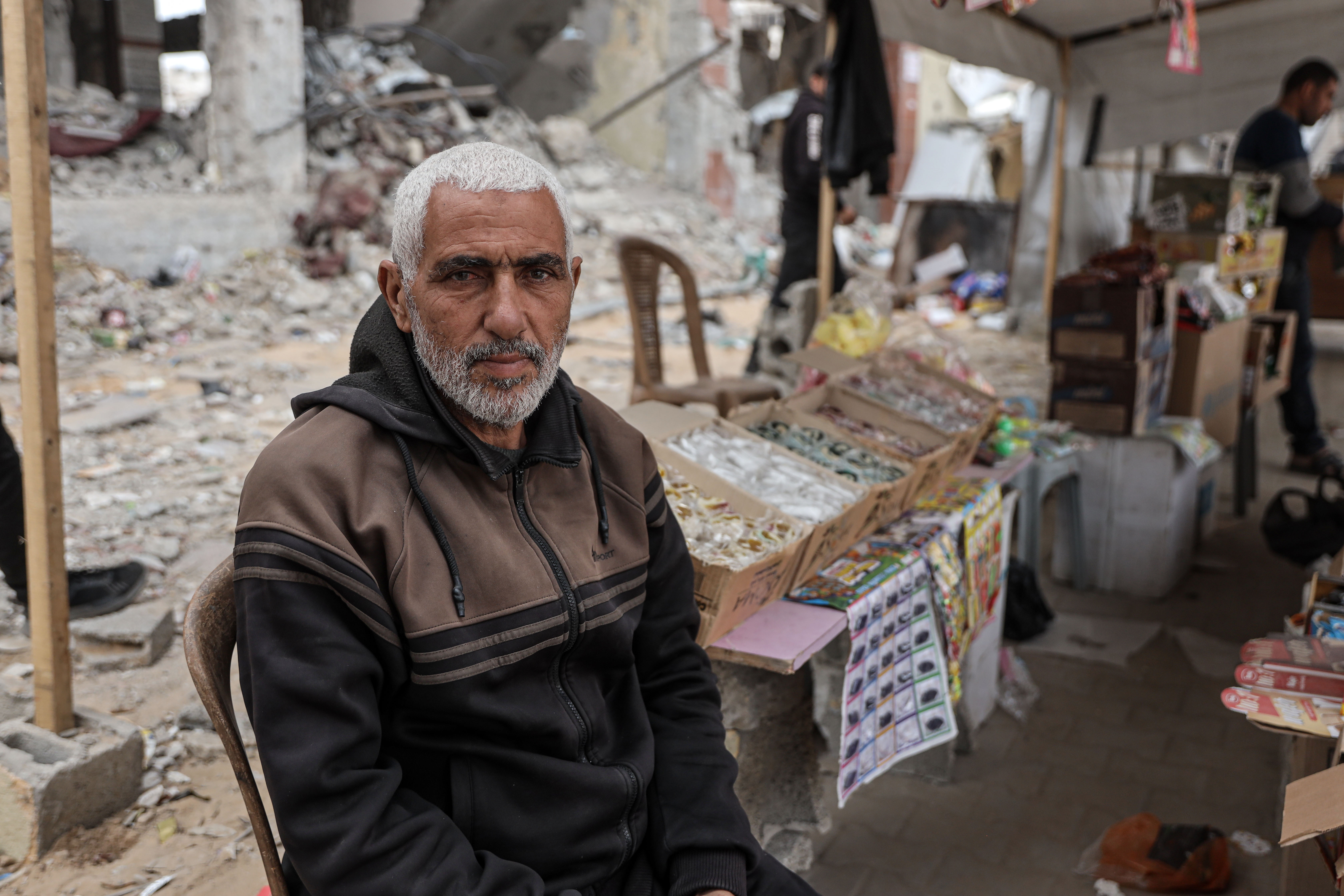 Al Jazeera spoke to Palestinians in norther Gaza about Trump’s threats. ‘Nothing left to grieve’ Yasser Al-Sharafa, 59, at his roadside stand selling candies and snacks in al-Rimal, central Gaza city [Abdelhakim Abu Riash/Al Jazeera]