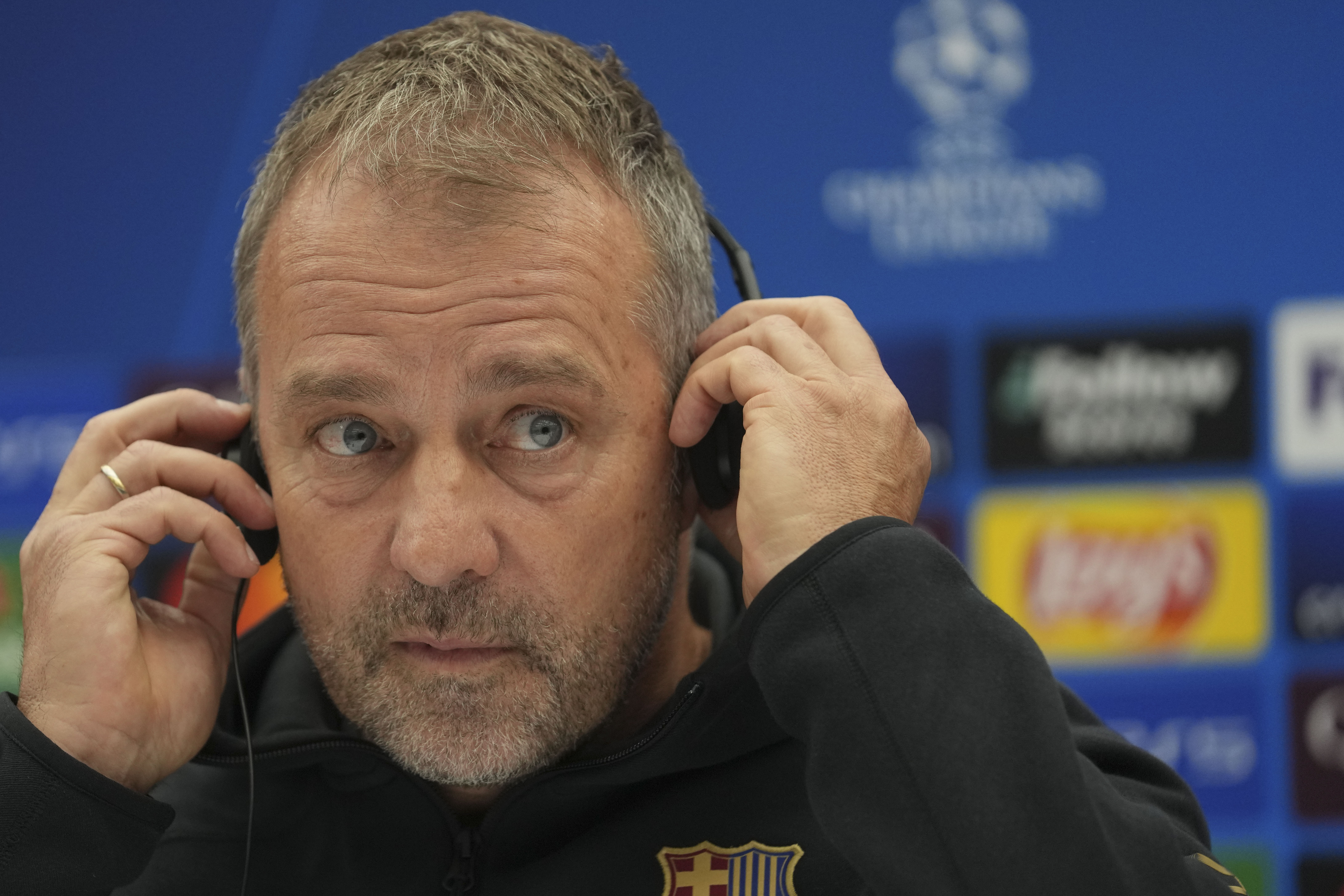 Barcelona's head coach Hansi Flick listens to a question during a news conference at the Rajko Mitic Stadium in Belgrade, Serbia, Tuesday, Nov. 5, 2024, ahead of the Champions League opening phase soccer match between Red Star and Barcelona on Wednesday. (AP Photo/Darko Vojinovic)
