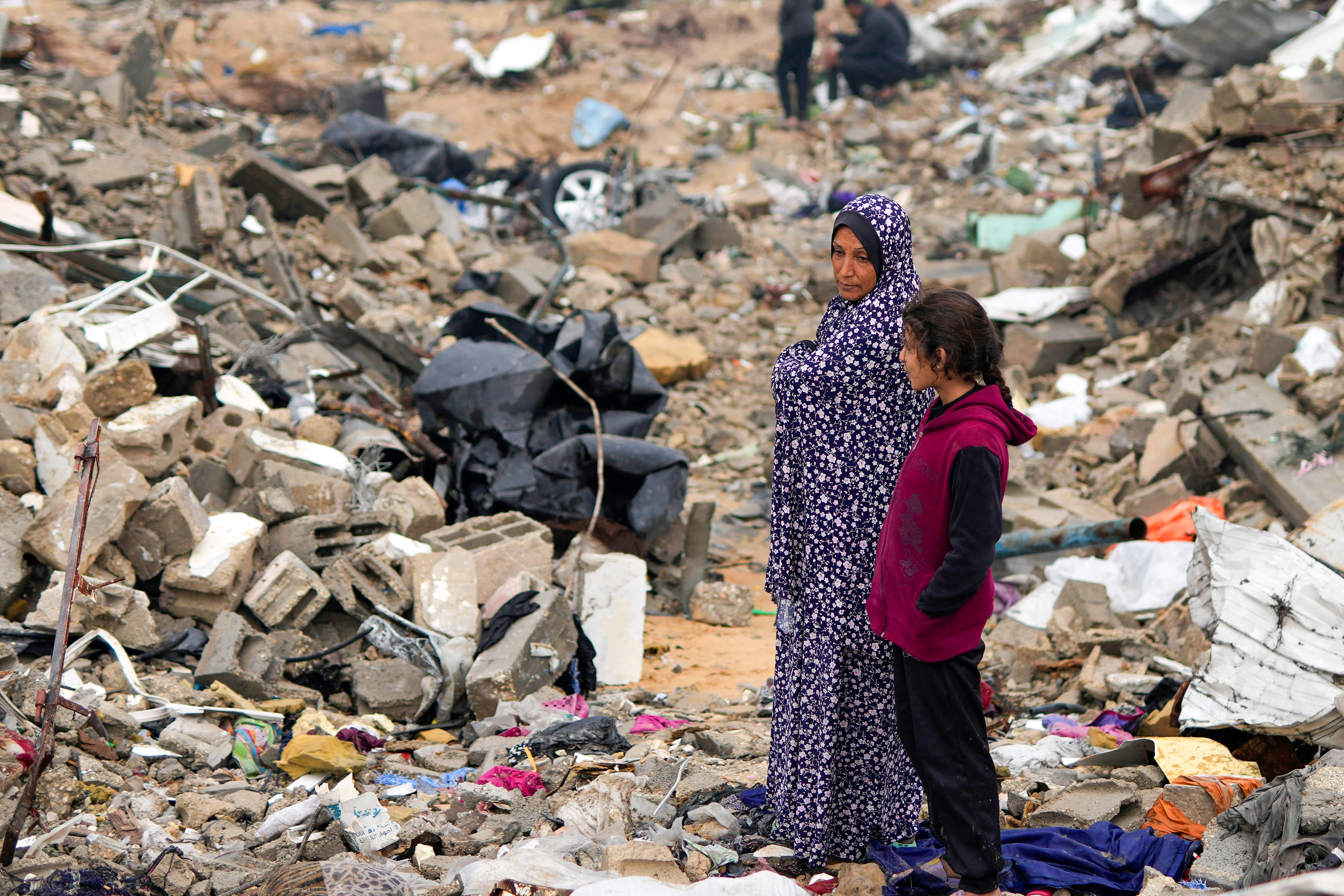 The Rehan family in their encampment in the ruins of their home amid widespread destruction caused by the Israeli military's ground and air offensive in Jabaliya, Gaza