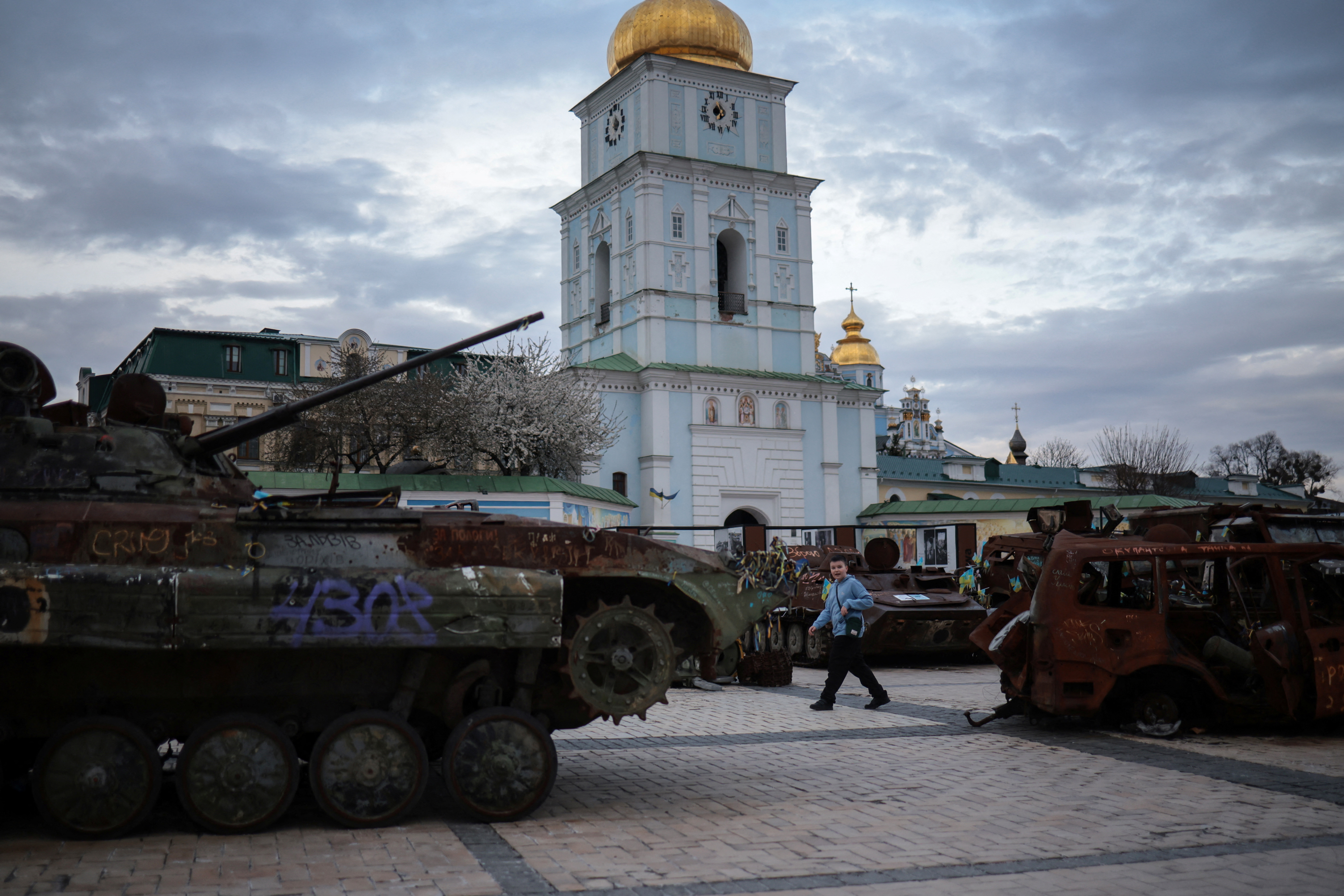 A boy looks at an exhibition displaying destroyed Russian military vehicles, amid Russia's attack on Ukraine, in Kyiv, Ukraine April 15, 2025. REUTERS/Marko Djurica