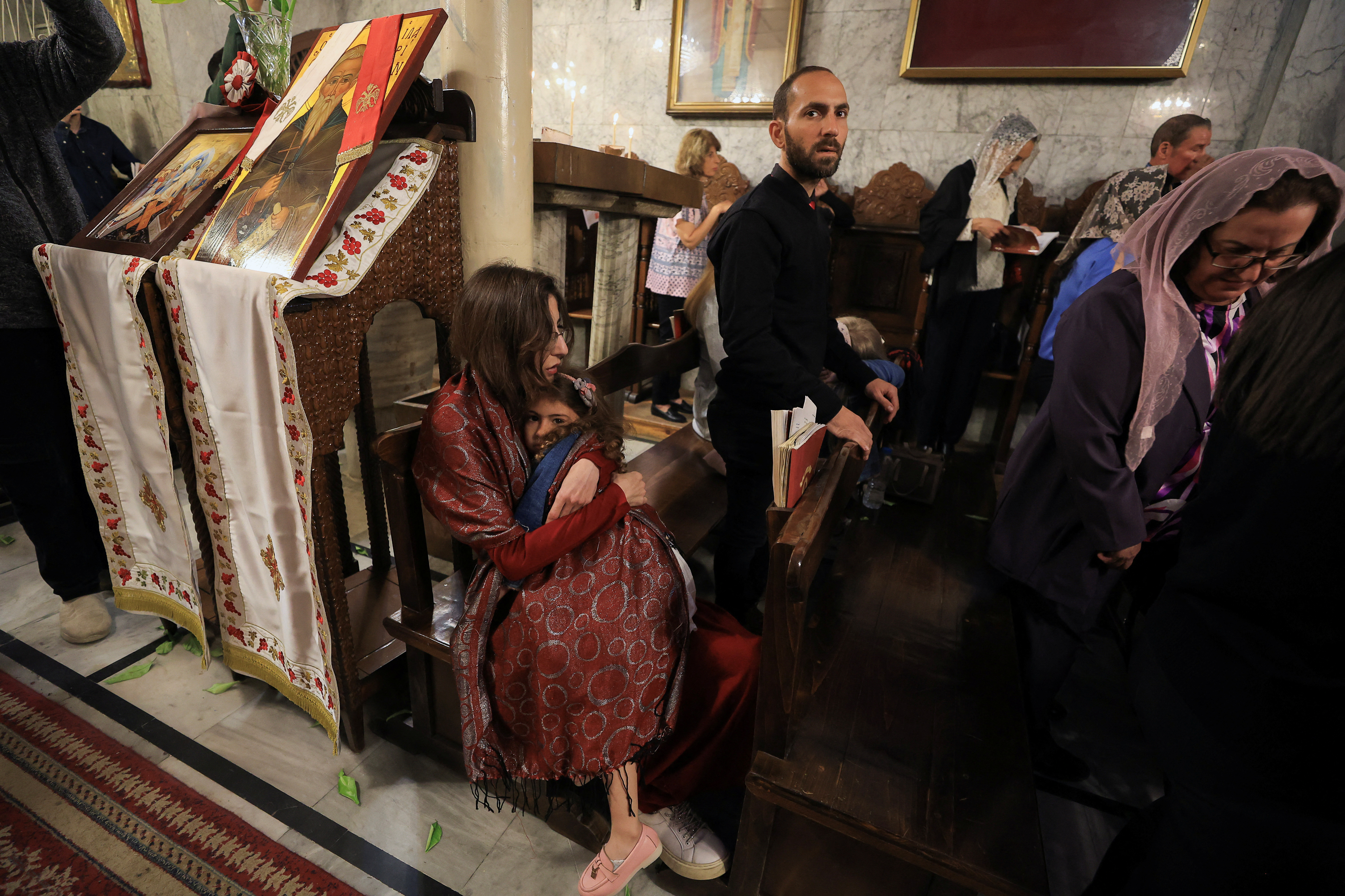 Palestinian Christians attend an Easter Mass at the Greek Orthodox Saint Porphyrius Church, in Gaza City