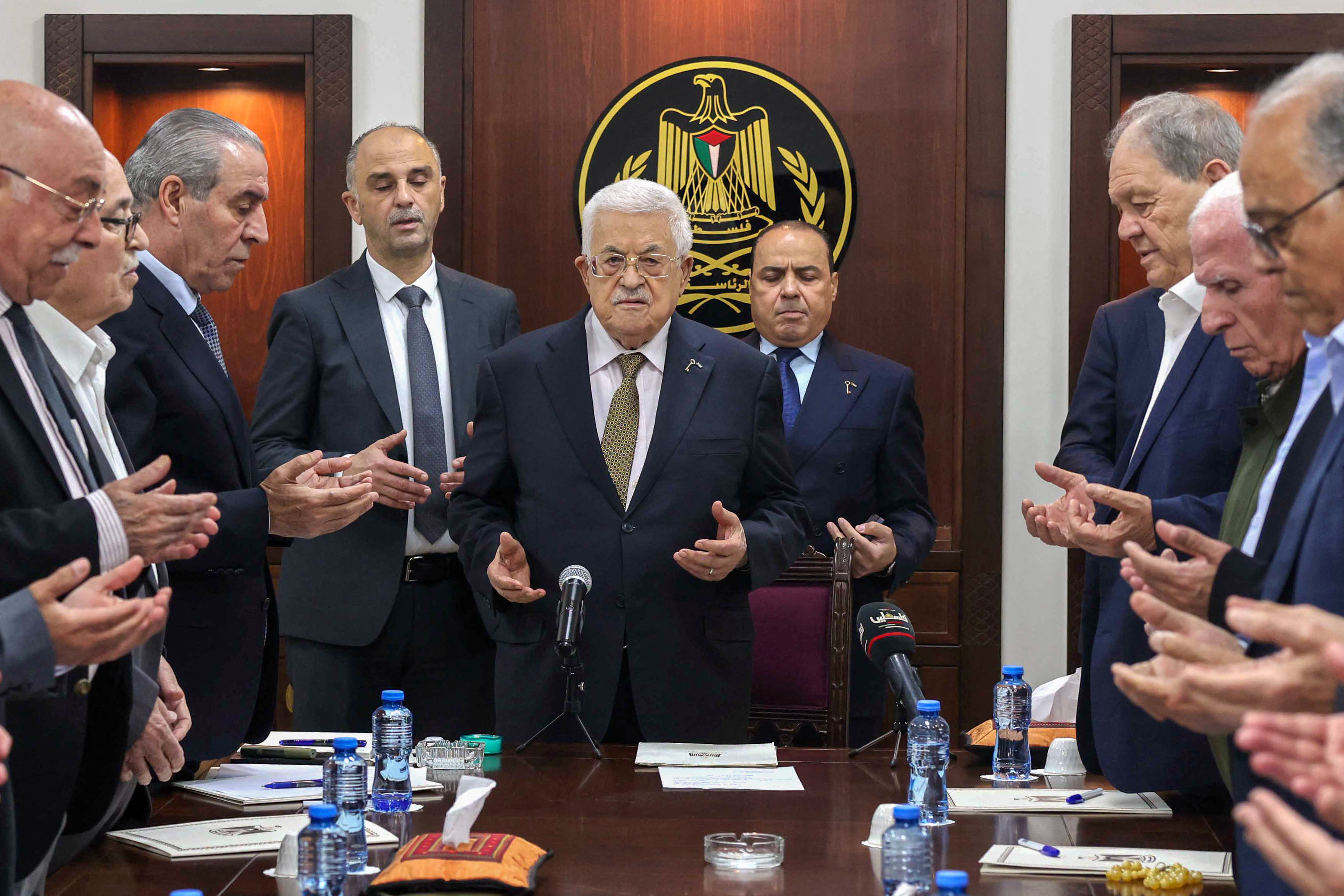 Palestinian Authority President Mahmud Abbas (C) leads prayers during a meeting of the Palestine Liberation Organisation's Executive Committee in Ramallah on April 26, 2025.