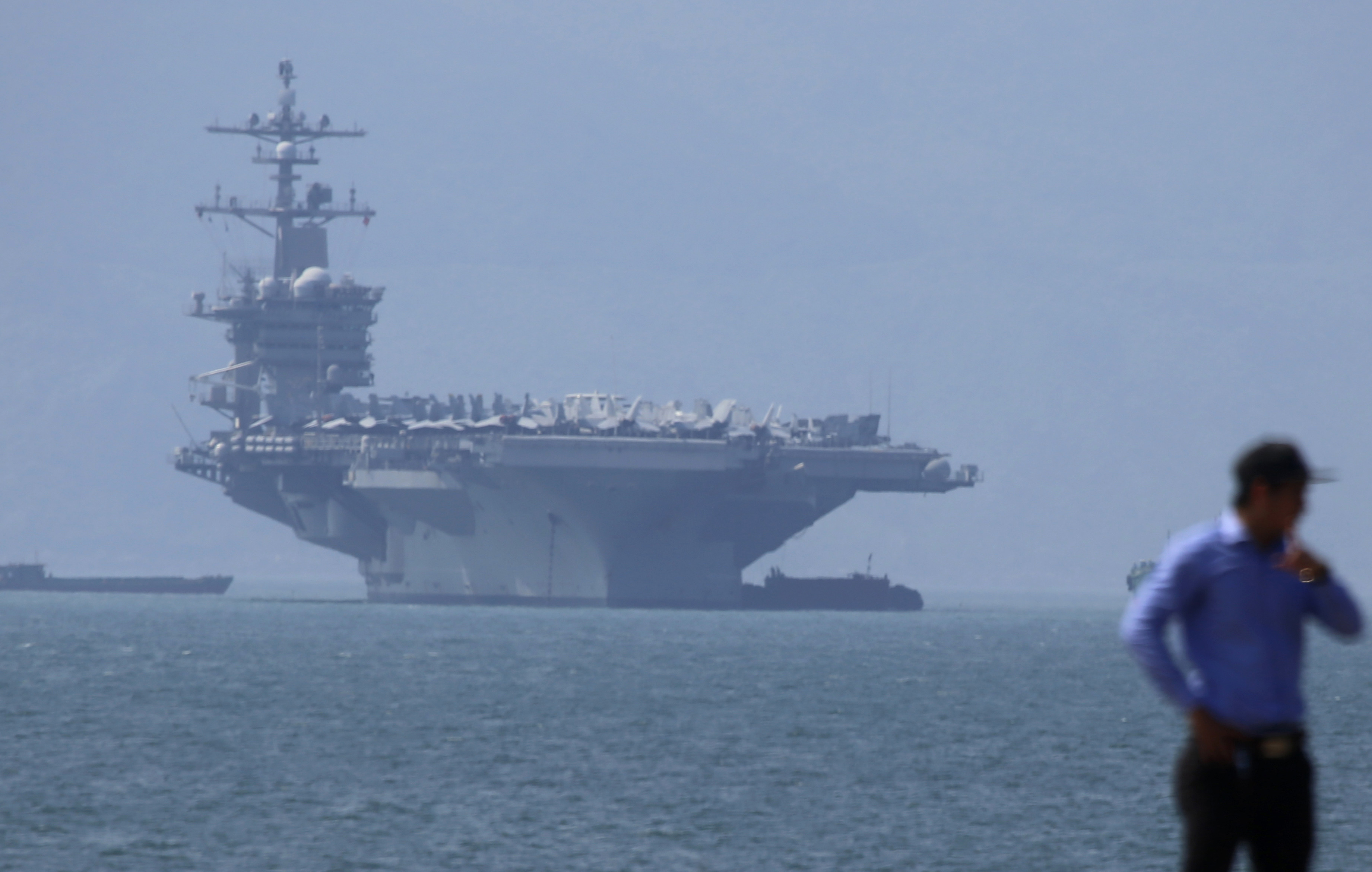 FIEL - In this March 5, 2018, file photo, USS Carl Vinson is anchored at Tien Sa Port in Danang, Vietnam. The U.S. Navy aircraft carrier paid a visit to a Vietnamese port for the first time since the Vietnam War, seeking to bolster both countries' efforts to stem expansionism by China in the South China Sea. (AP Photo/Tran Van Minh, File)