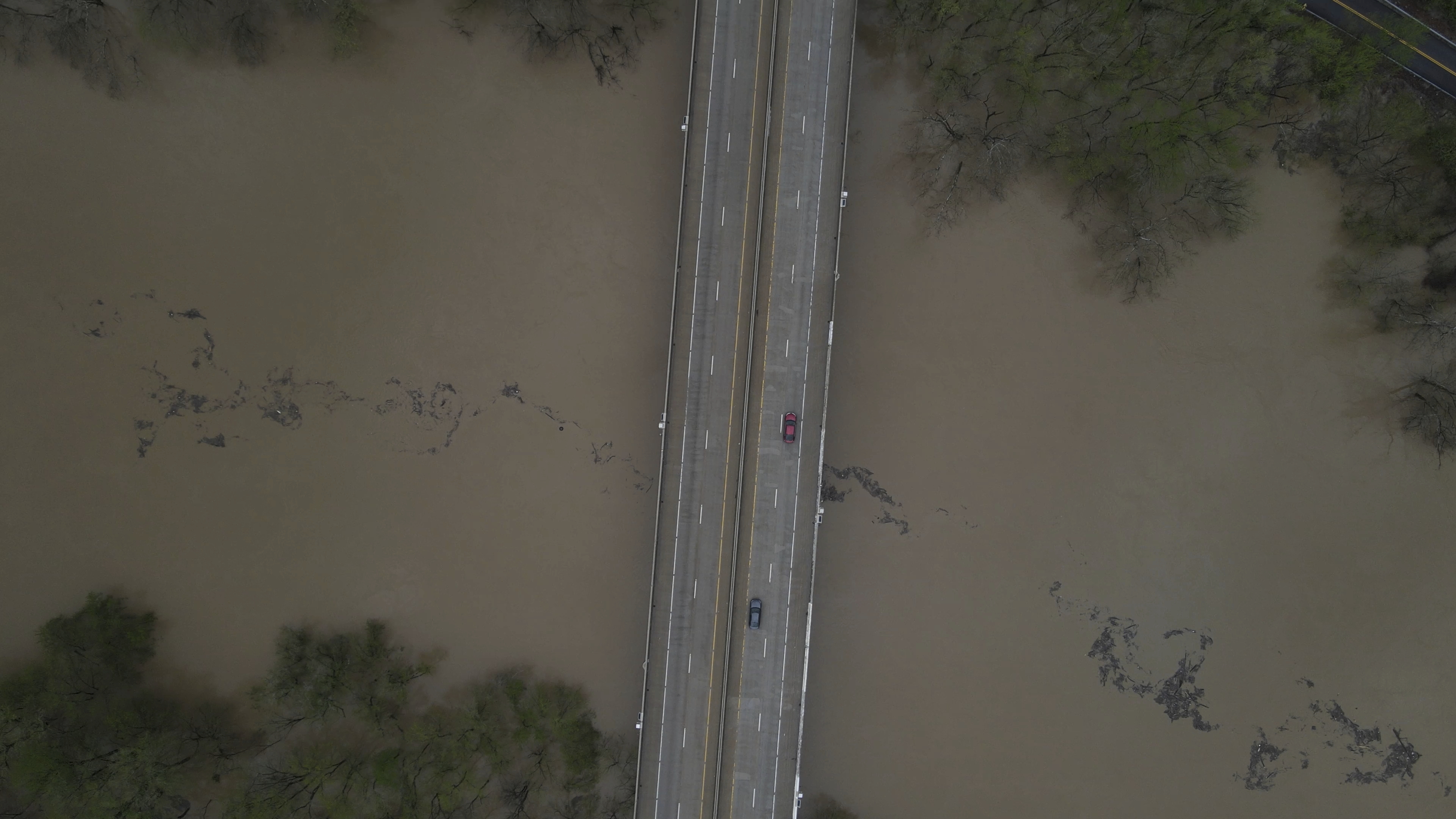 An aerial view of debris floating down the Kentucky Rive