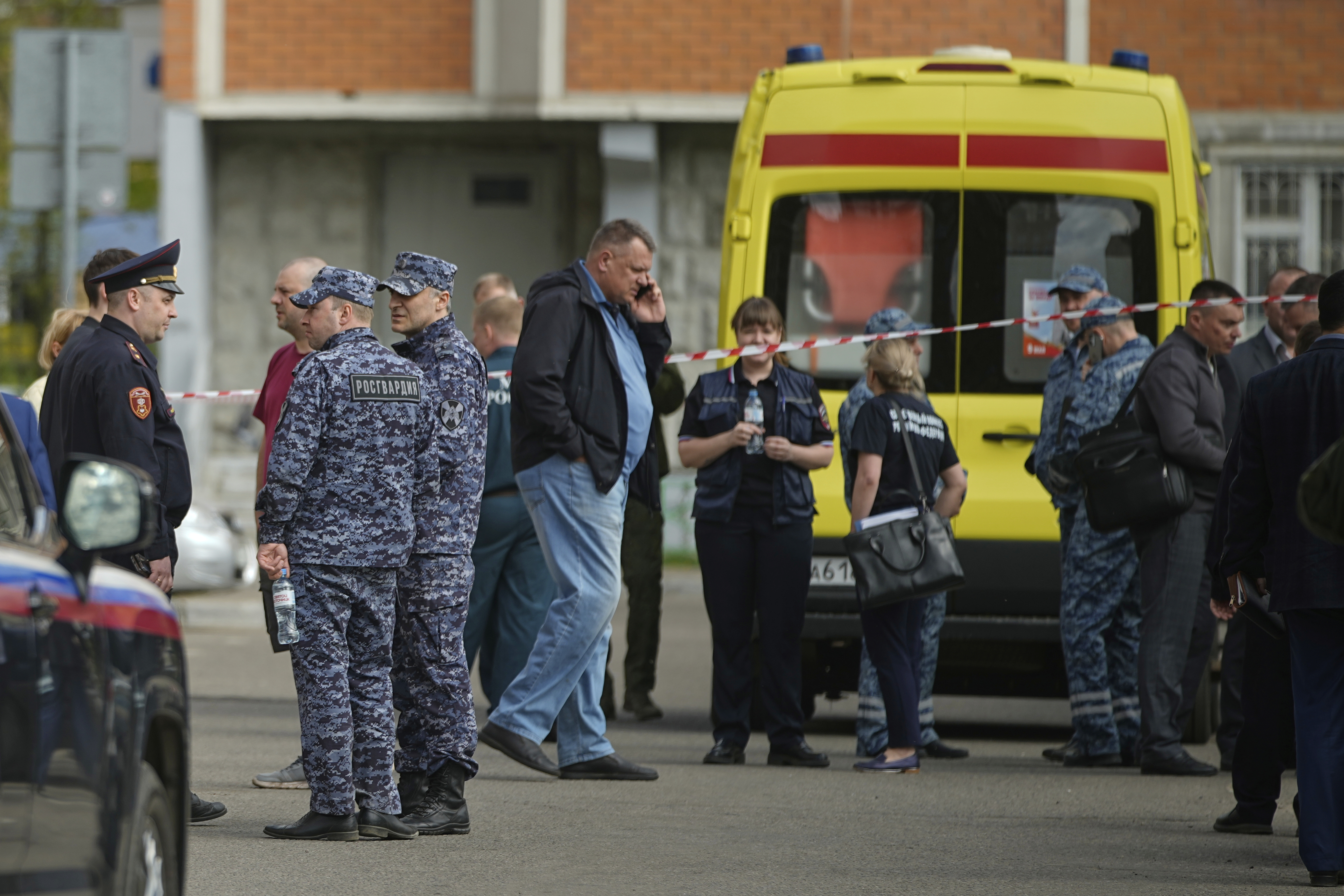 Police and investigators work at the scene where Lt. Gen. Yaroslav Moskalik, a deputy head of the main operational department in the General Staff of the Russian armed forces, was killed by an explosive device placed in his car in Balashikha, just outside Moscow, Russia, on Friday, April 25, 2025. (AP Photo)