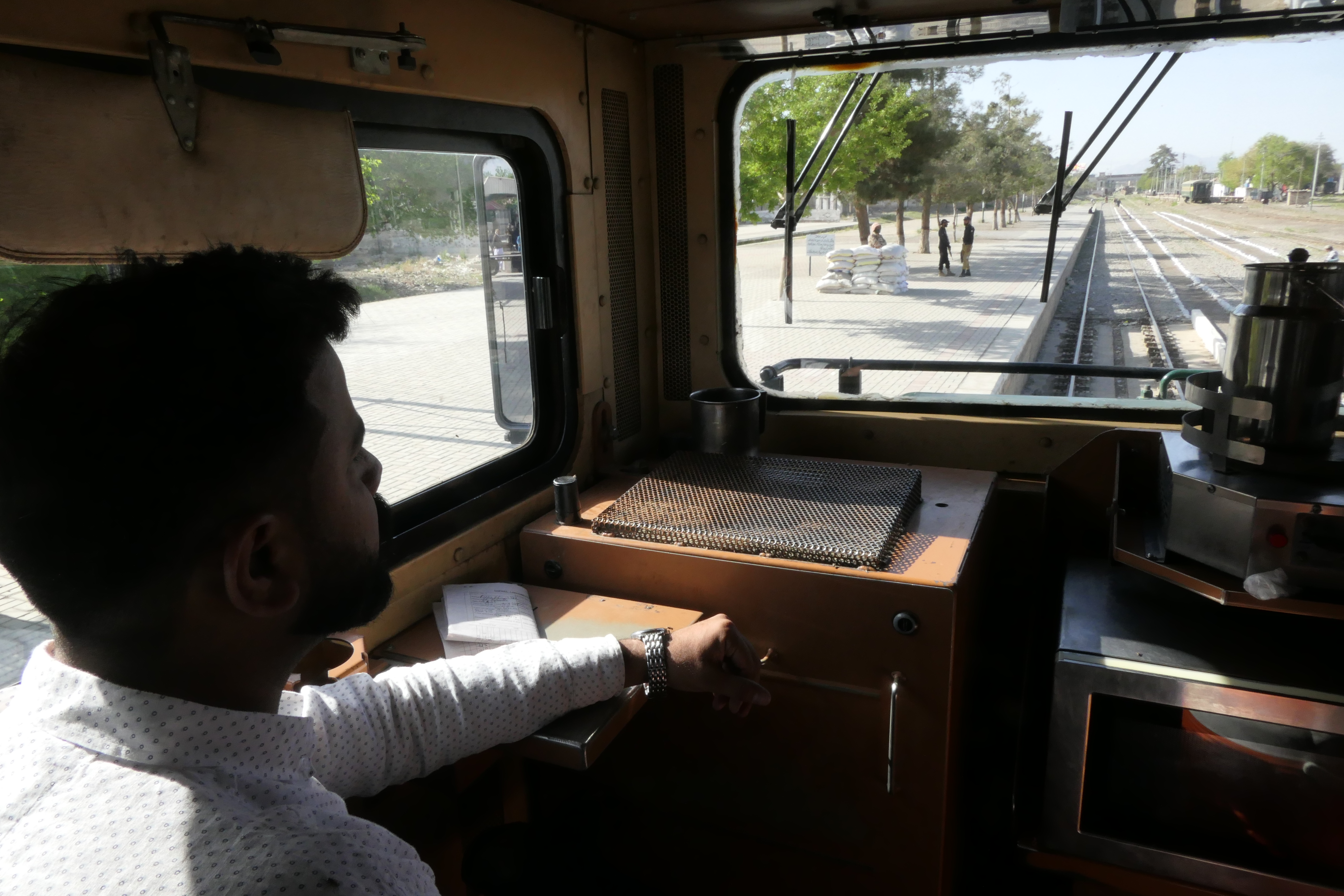 Saad inside the Jaffar Express, on Thursday, April 3, 2025 — his first day back on the job after the train hijack on March 11 [Saadullah Akhter/Al Jazeera] 