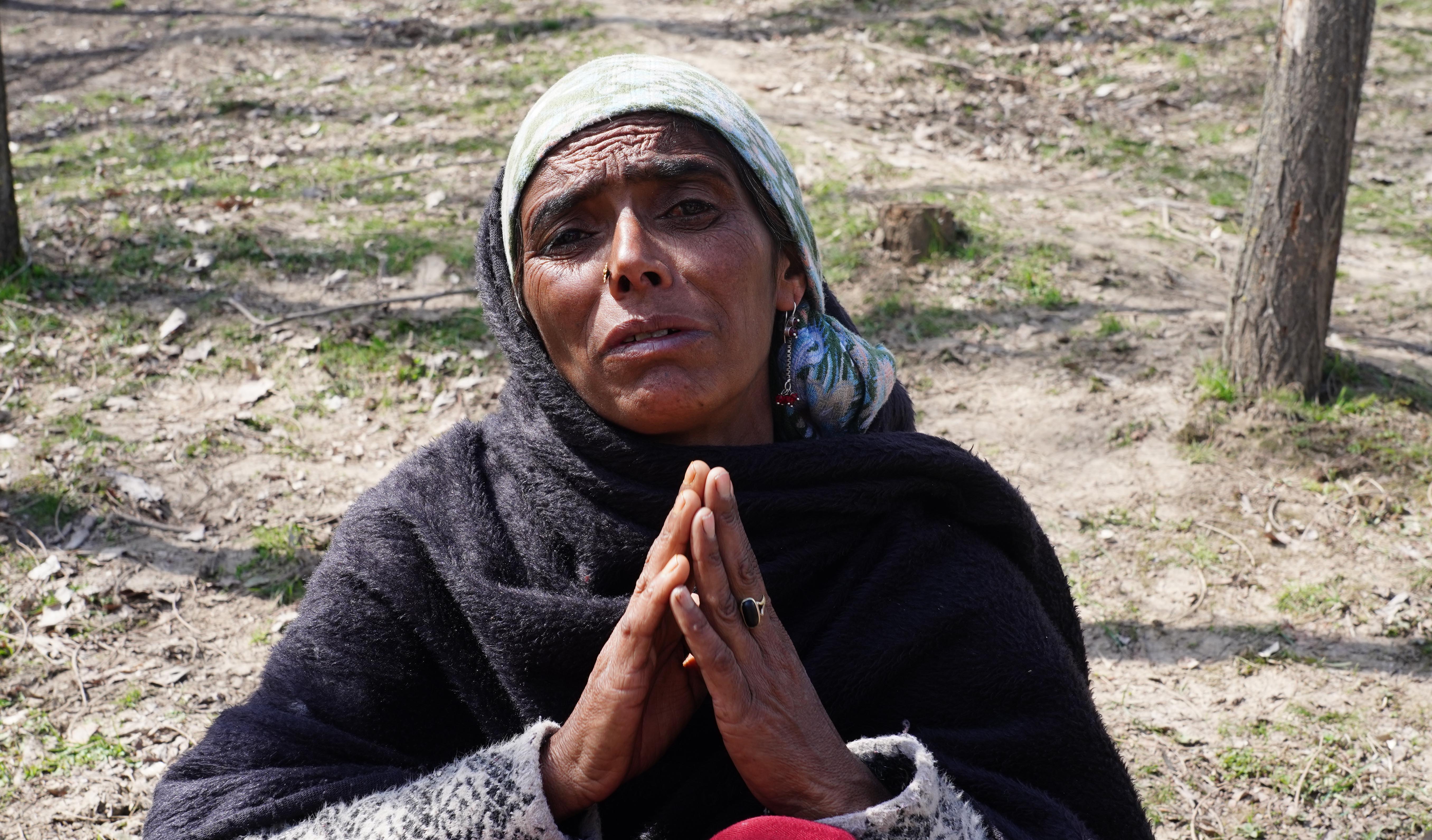 Meema Begum, mother of Riyaz and Showkat, mourns outside their house in Chandian Paha village of Kulgam, Kashmir. Photo Sajad Hameed