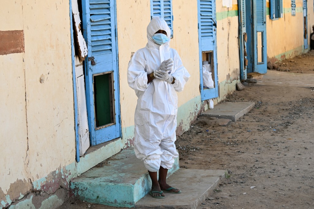 A health worker wears a protective outfit at a hospital where cholera patients are treated in Sudan: [File: AFP]