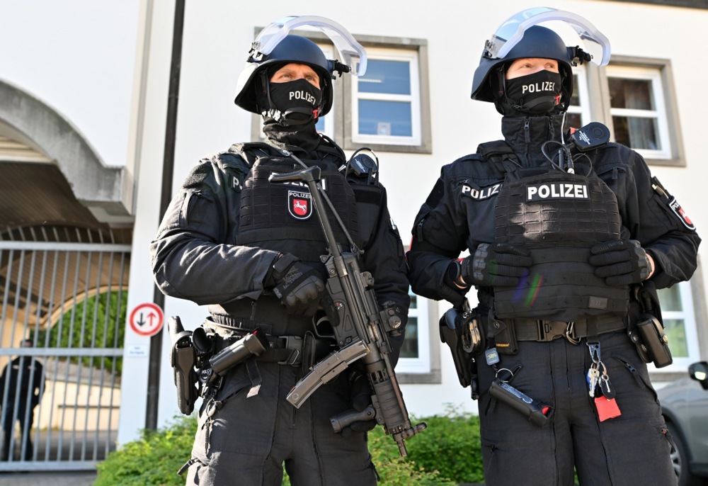 epa12077342 Police officers stand guard outside the Celle Higher Regional Court on the day of the trial of Daniela Klette (not pictured), a former member of German far-left militant group The Red Army Faction (RAF), in Celle, Germany, 06 May 2025. Klette, who was arrested in 2024 after more than 30 years on the run, has been part of the radical anti-capitalist group RAF, also known as Baader-Meinhof Gang, which carried out a series of bombings, kidnappings, assassinations and bank robberies in the 1970s and 1980s. EPA-EFE/FABIAN BIMMER