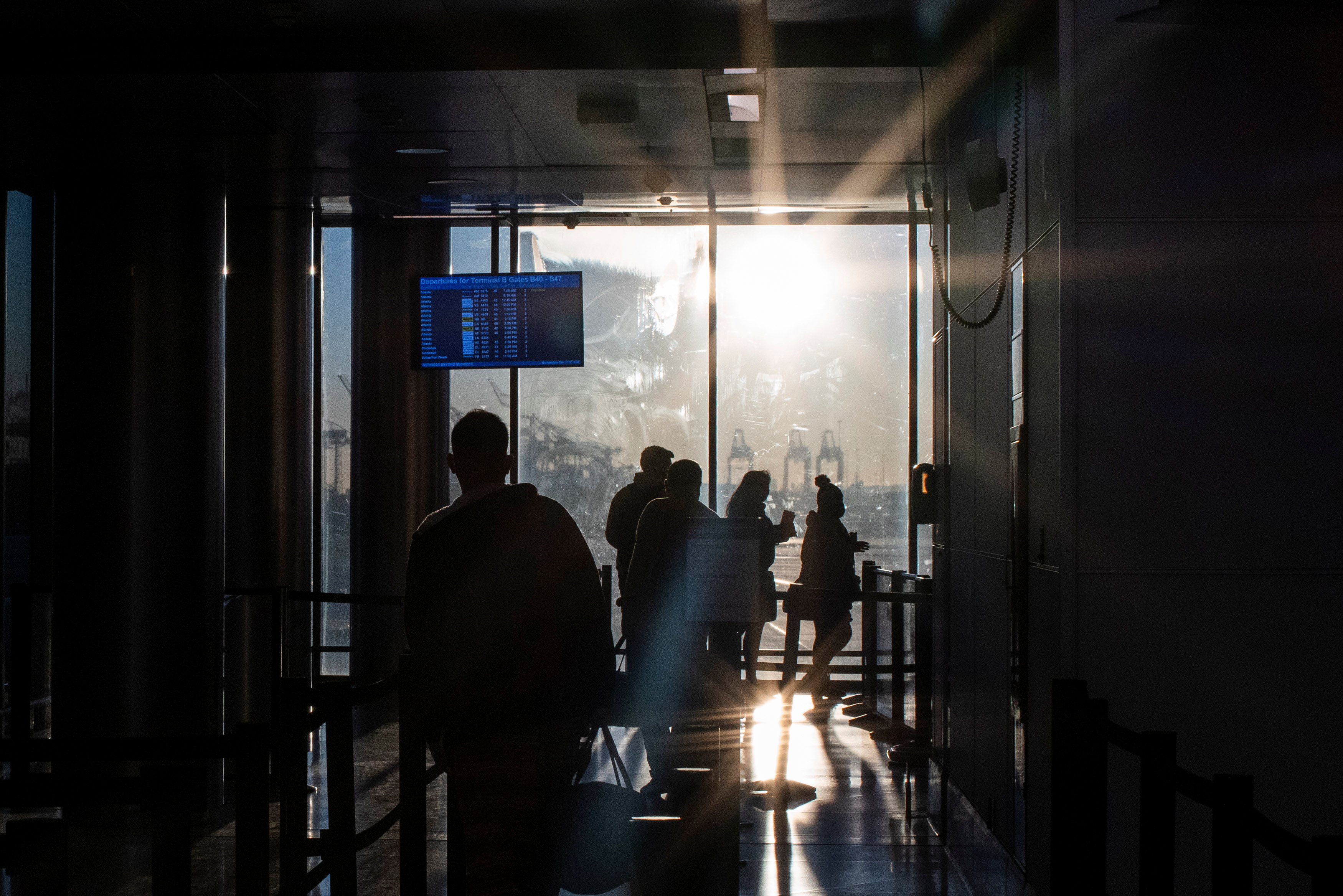 Passengers walk through the terminal at Newark airport