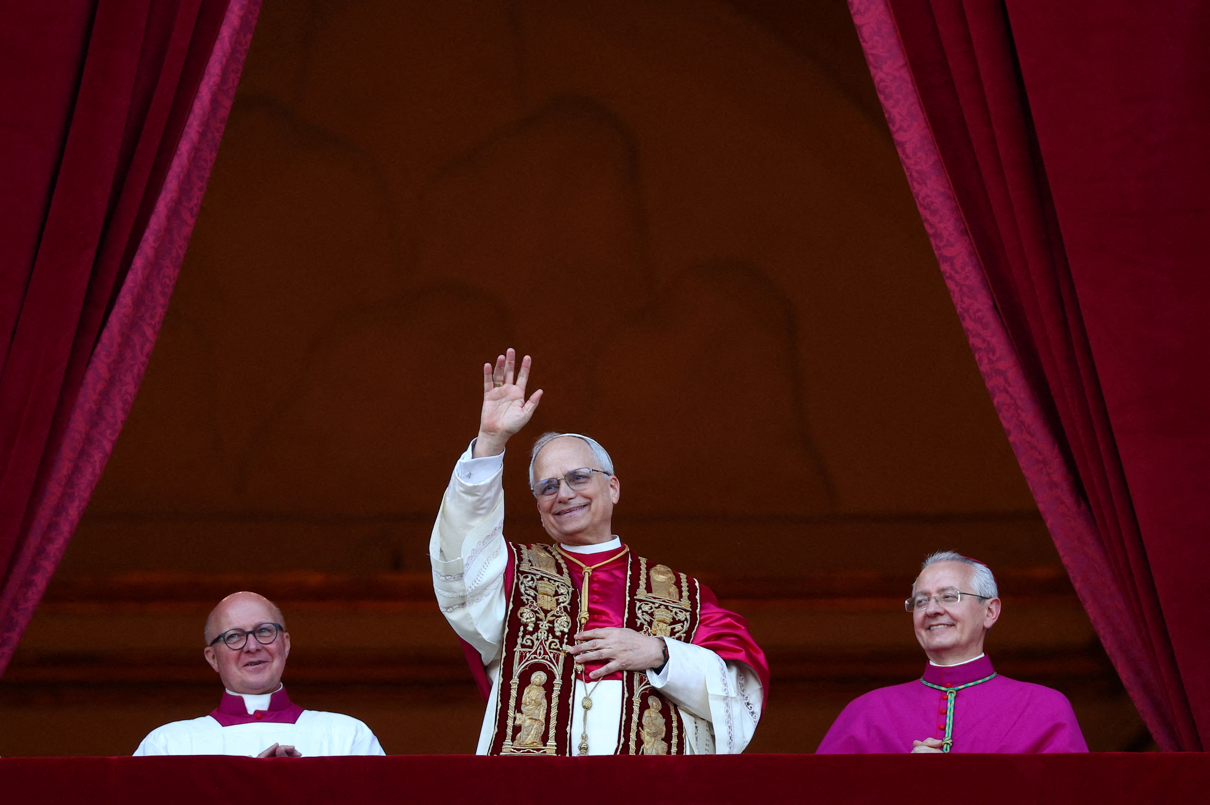 Leo XIV waves from a Vatican balcony
