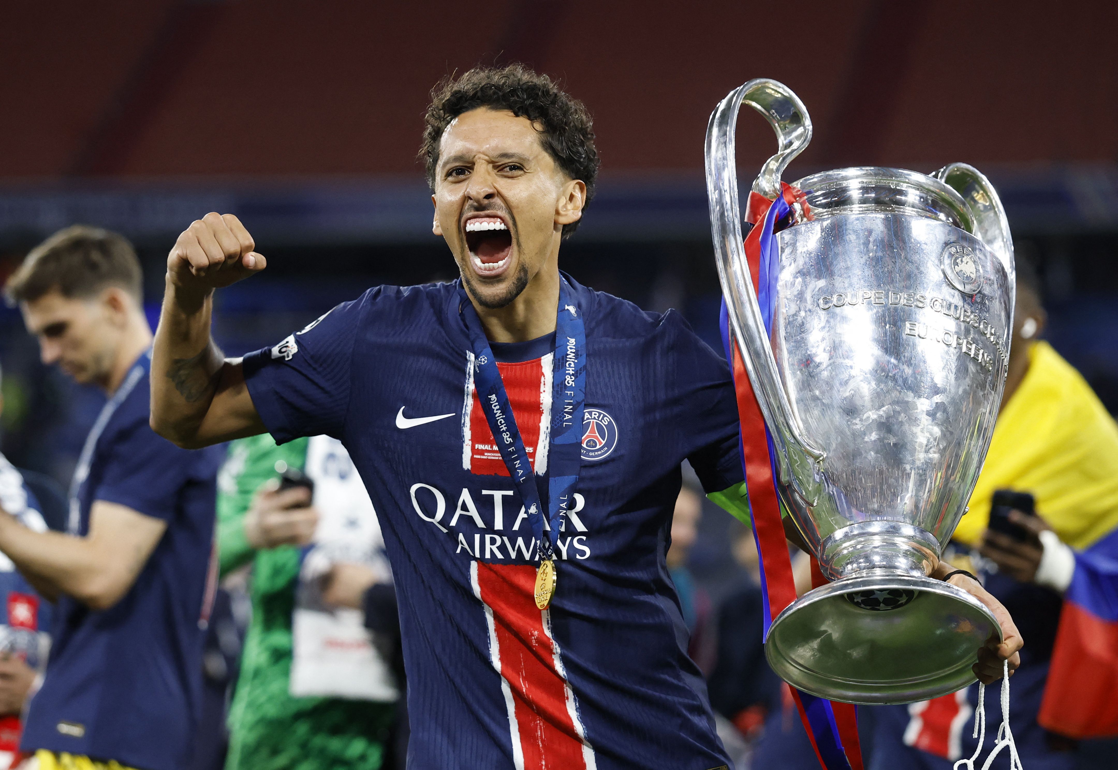Champions League - Final - Paris St Germain v Inter Milan - Allianz Arena, Munich, Germany - May 31, 2025 Paris St Germain's Marquinhos celebrates with the trophy after winning the Champions