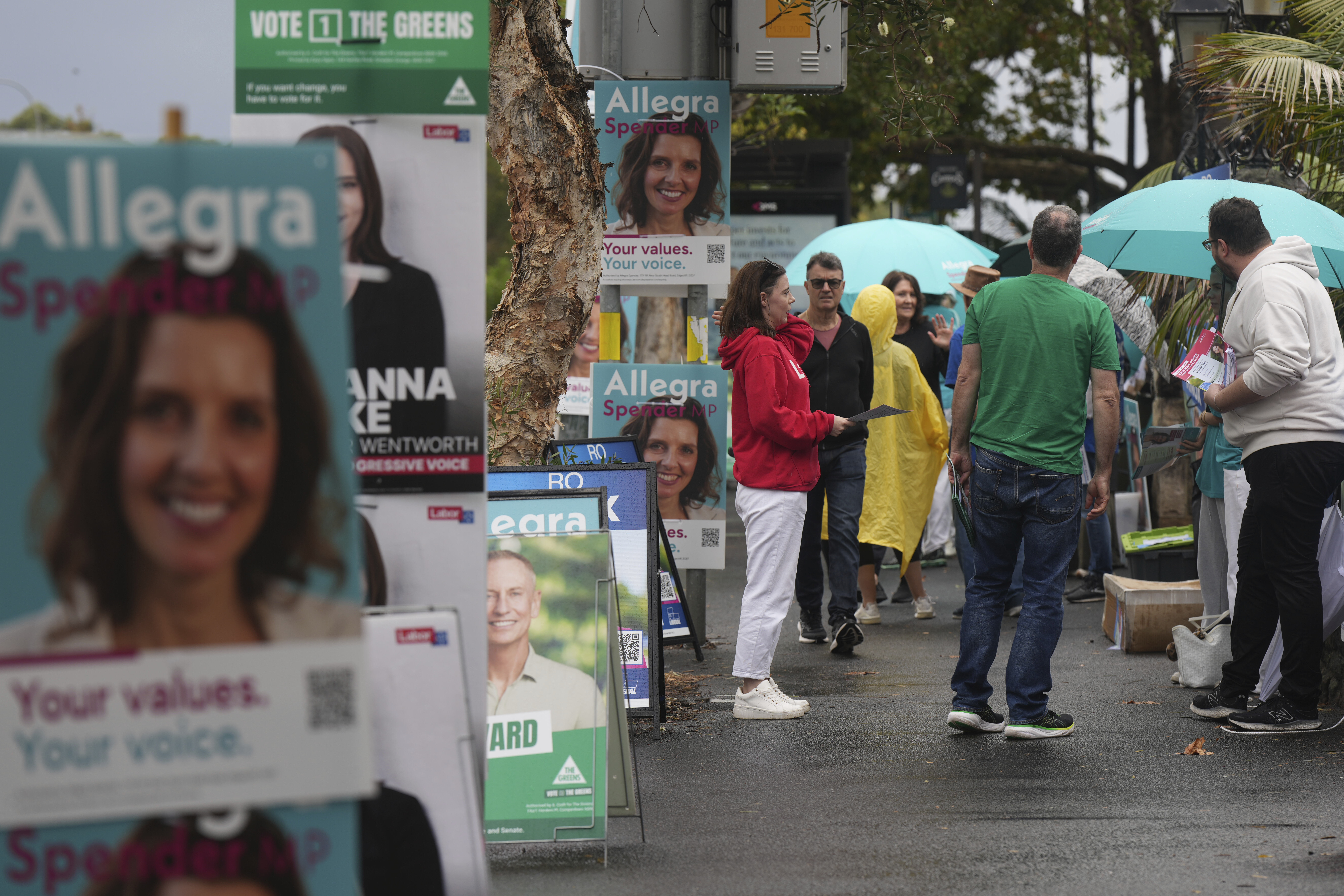 People arrive at a polling place as early voting begins in Sydney, Tuesday, April 22, 2025, for a national election to be held on May 3. (AP Photo/Mark Baker)