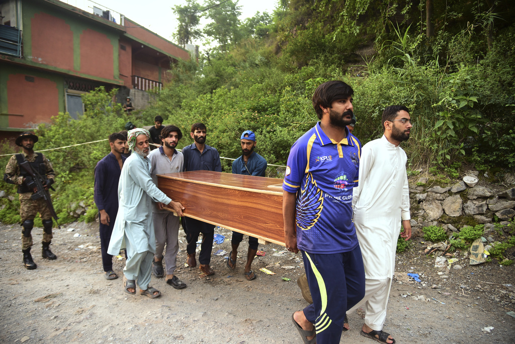 men carry a coffin