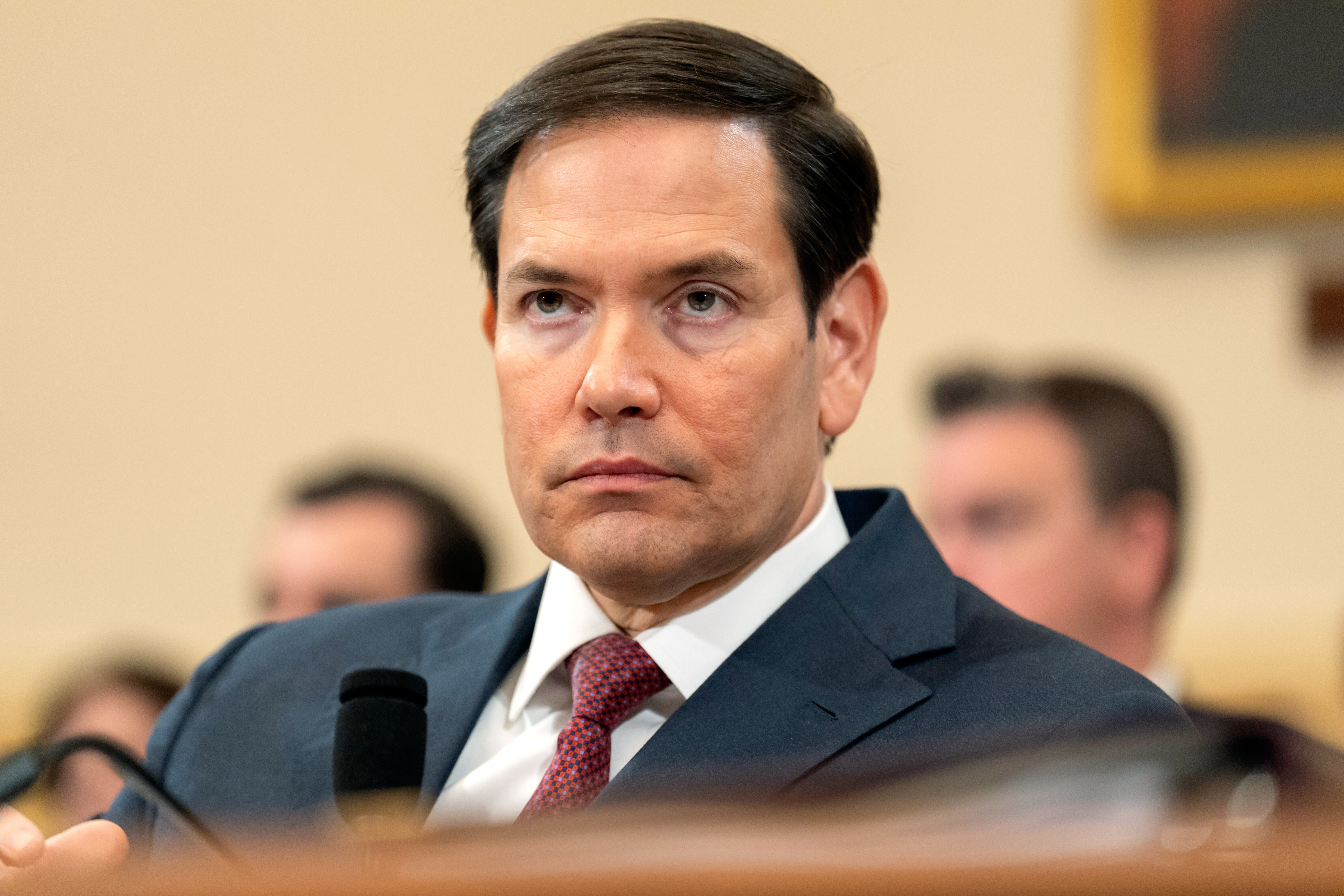 Secretary of State Marco Rubio listens during a hearing.