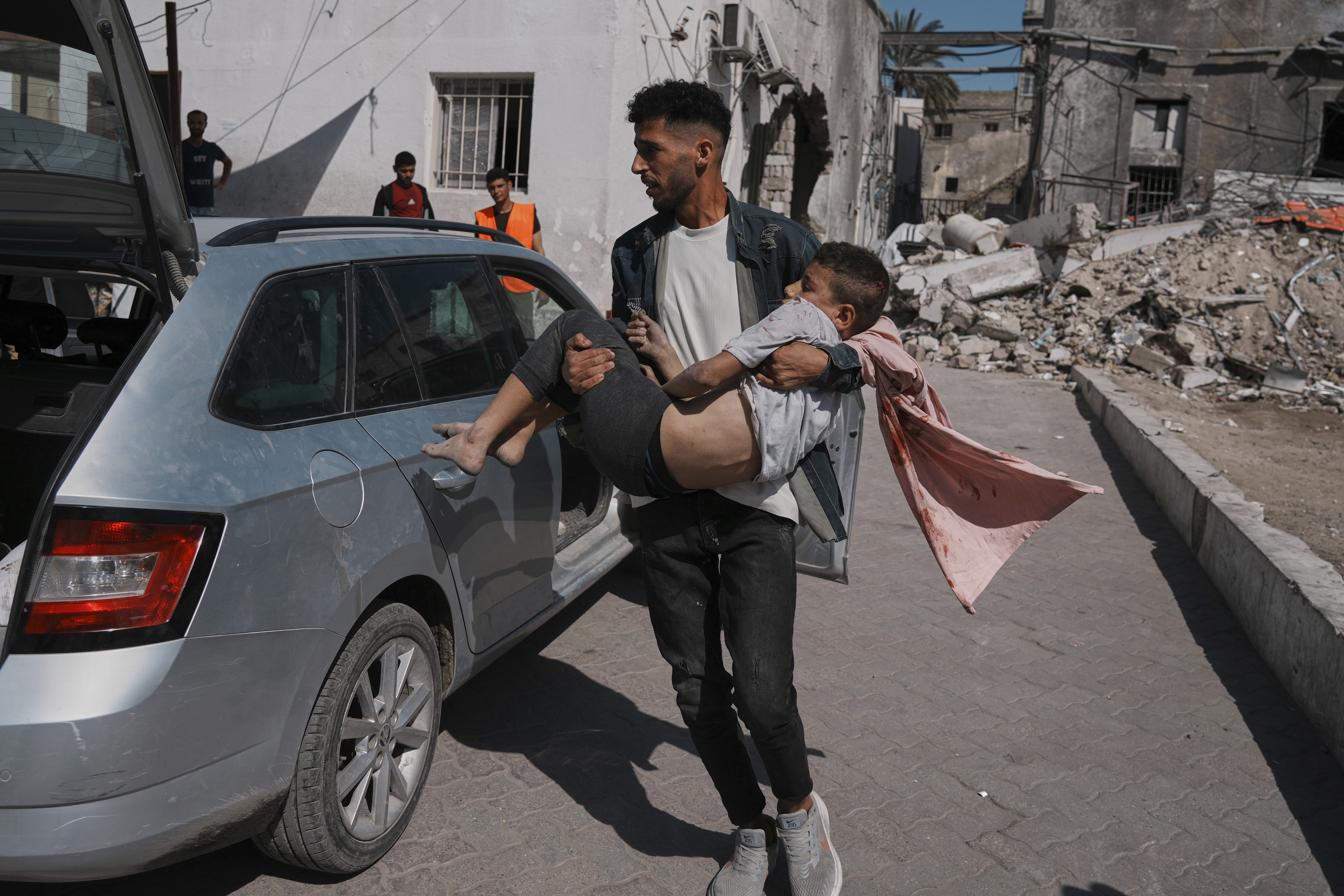 A Palestinian boy, injured following an Israeli airstrike, is brought for treatment to the Baptist Hospital in Gaza City, Friday, May 30, 2025