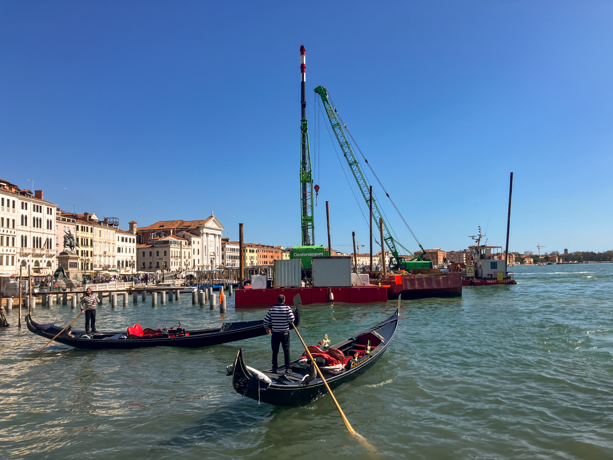  The modern pile-driver, or battipali, building a ferry terminal at the entrance to the Grand Canal. [Michela Moscufo/Al Jazeera]