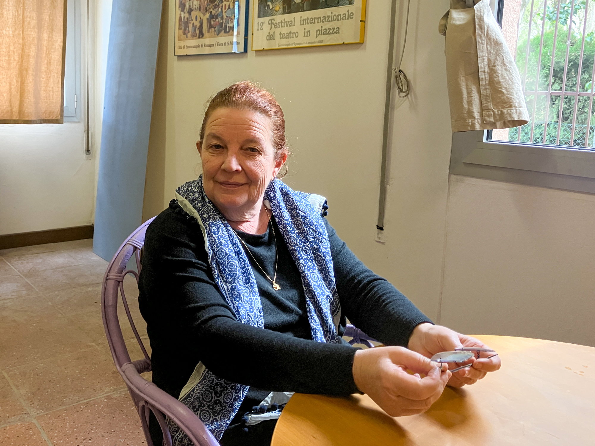 Giuseppina Casarin in a new rehearsal space she is hoping the choir will use for recording and rehearsal. [Michela Moscufo/Al Jazeera]