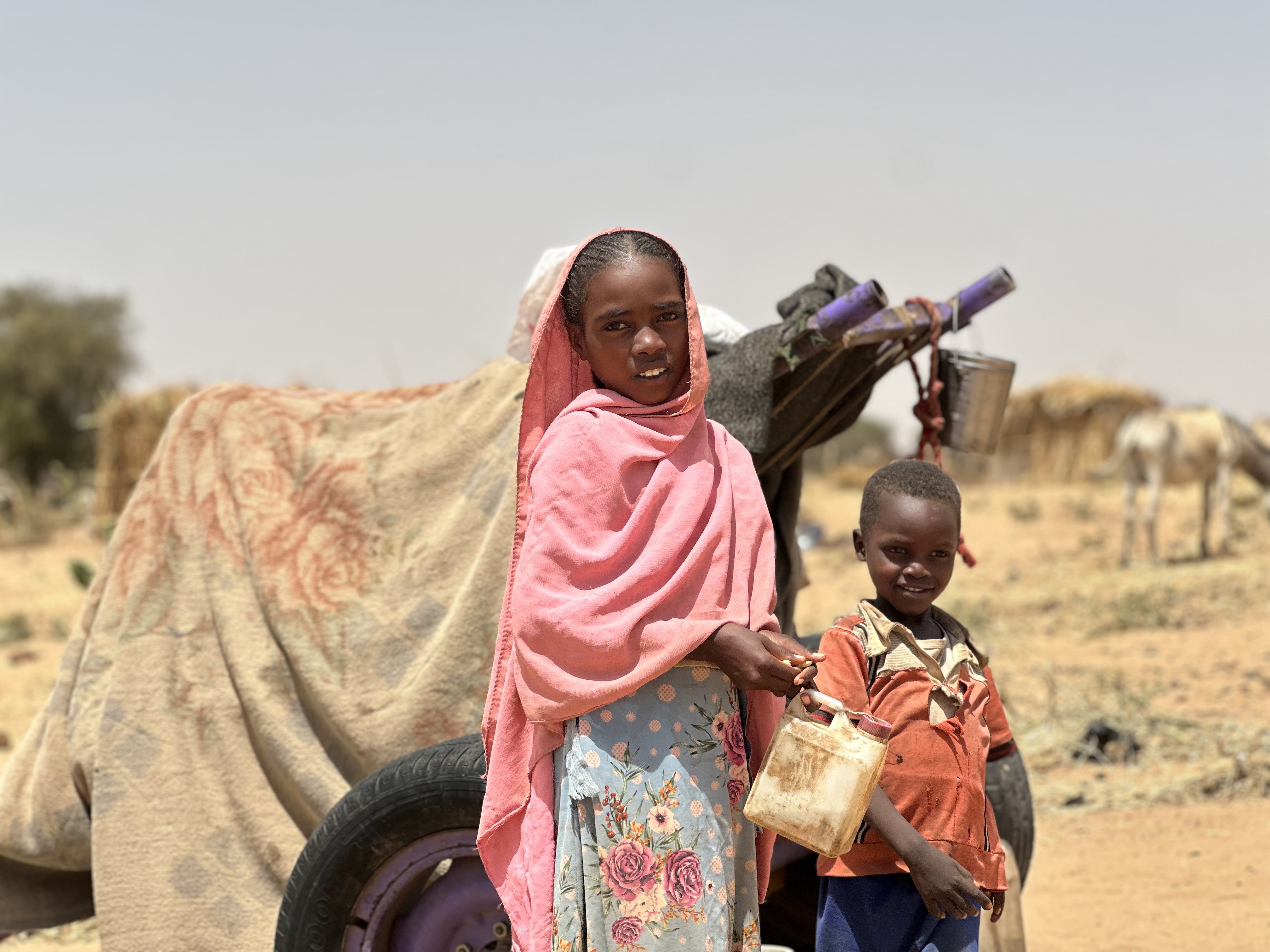 epa12049102 Sudanese children, who fled from the internally displaced persons (IDP) Zamzam camp, rest while on their way to the Tawila Camps amid the ongoing conflict between Sudan's army and the Rapid Support Forces (RSF), in North Darfur, Sudan, 23 April 2025. The RSF claimed control of the Zamzam camp after its assault in April 2025. According to the UNHCR, over four million people have fled Sudan to neighboring countries since the outbreak of the armed conflict in April 2023. EPA-EFE/MARWAN MOHAMED