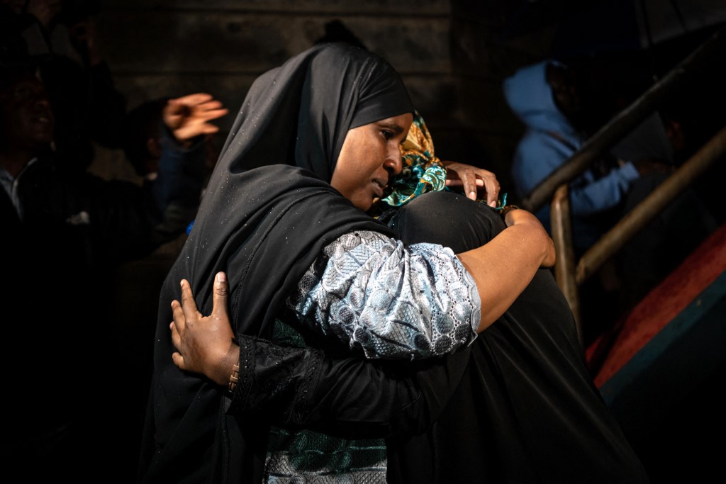 A woman reacts as she is reunite with family after being evacuated from the DusitD2 compound in Nairobi after a blast followed by a gun battle rocked the upmarket hotel complex on January 15, 2019. [File: Fredrik Lerneryd/AFP]