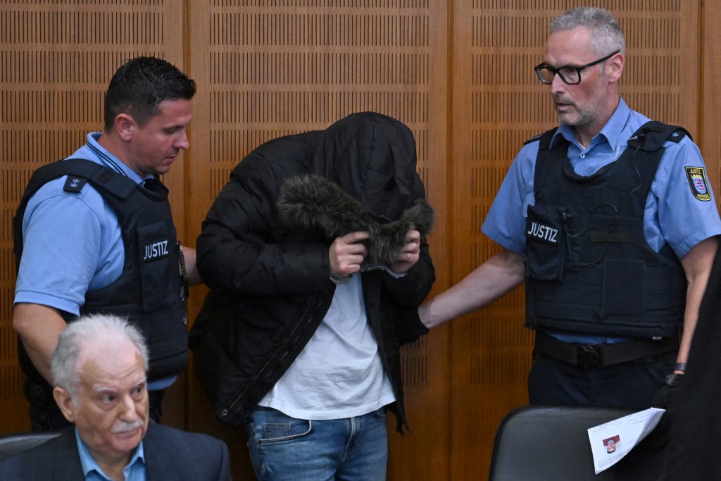 Alaa Mousa, accused of crimes against humanity under former Syrian dictator Bashar al-Assad's regime, arrives at court