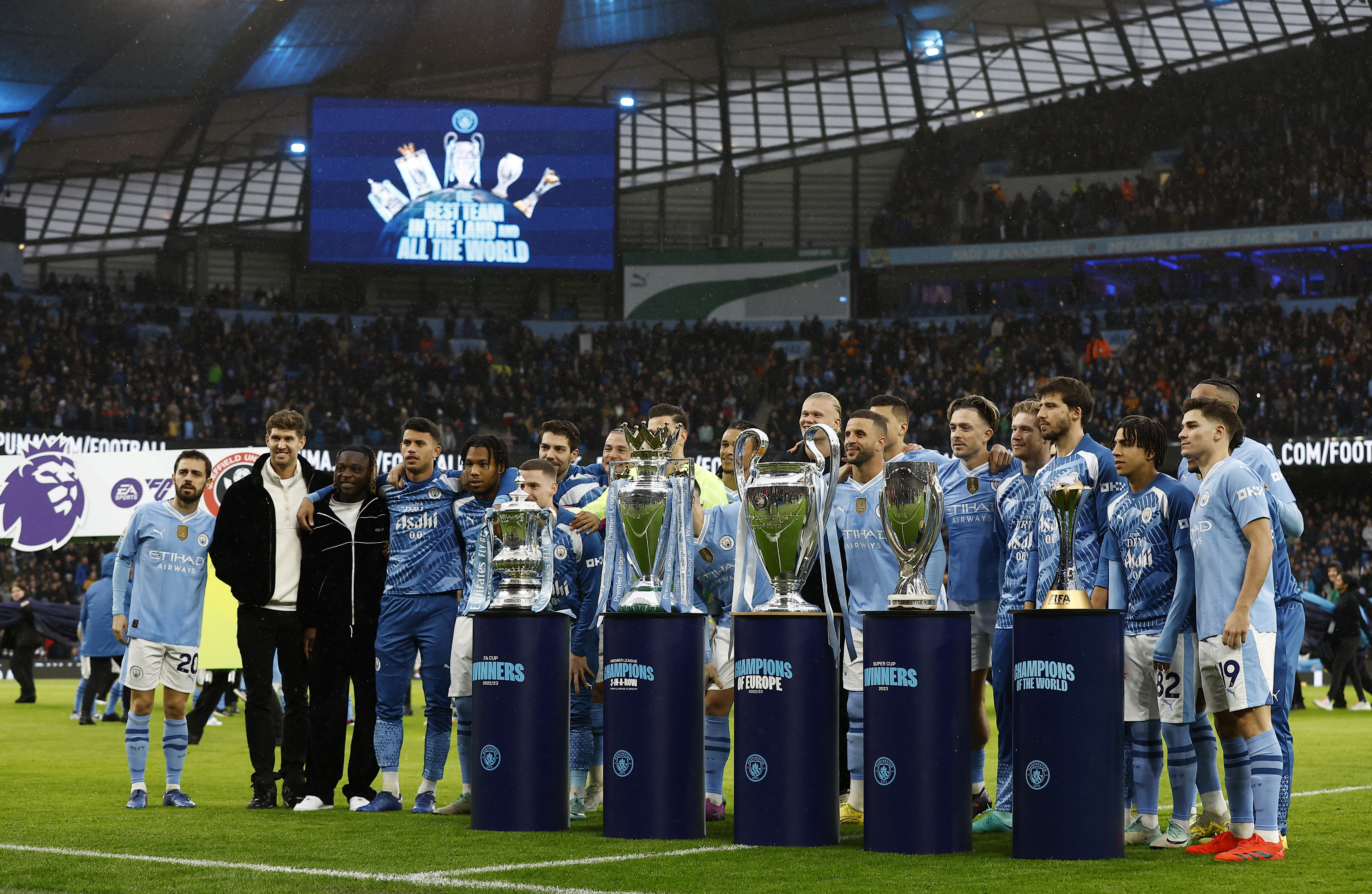 General view as the Manchester City players pose with the Premier League, Champions League, FA Cup, Club World Cup and the Super Cup