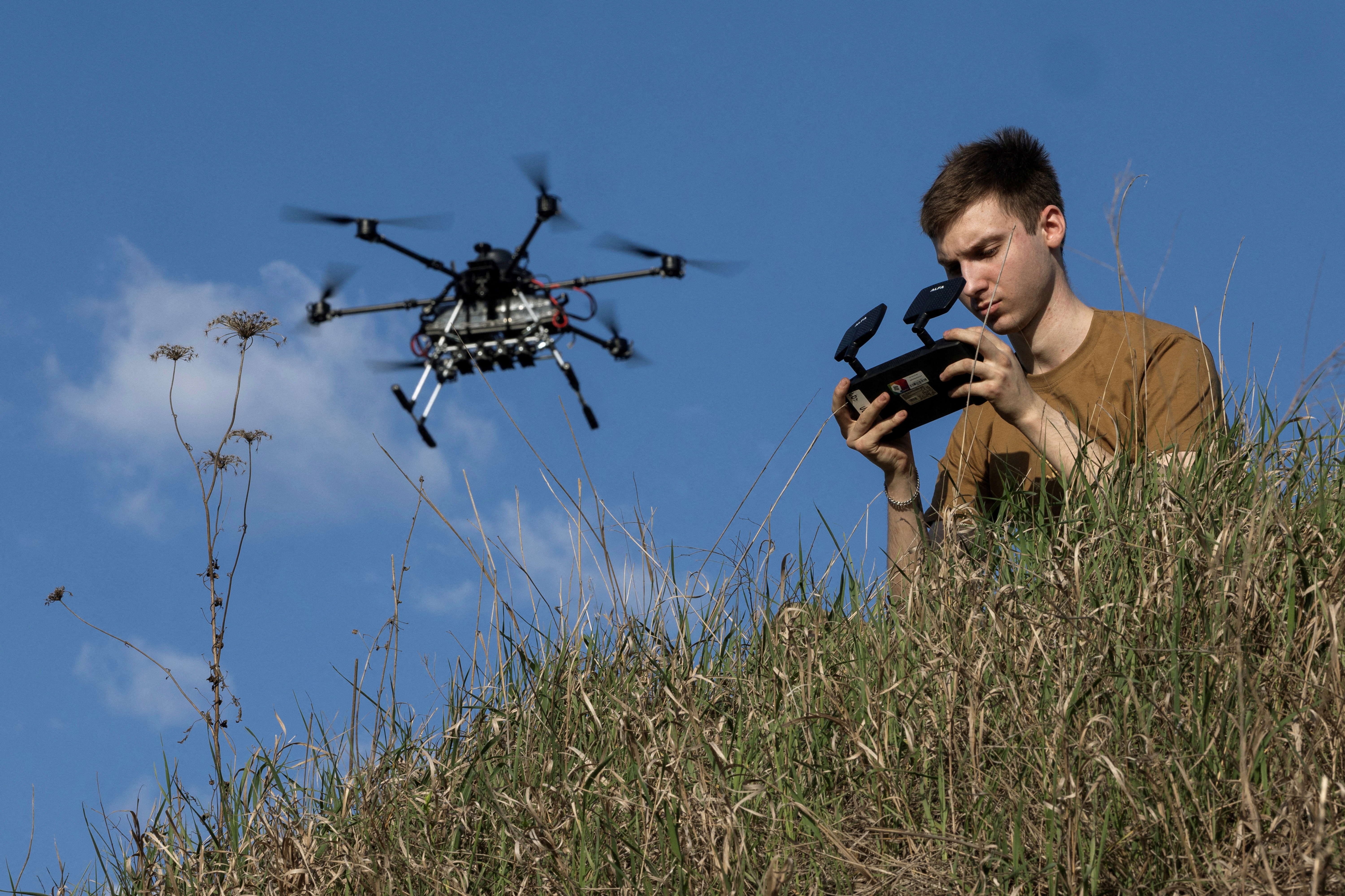 Ukrainian serviceman of the 13th operational NGU Khartiia Brigade with the call signs 'Chipok' controls the Vampire drone during test and training flight, amid Russia's attack on Ukraine, at an undisclosed location in the Kharkiv region, Ukraine, April 22, 2025. REUTERS/Marko Djurica