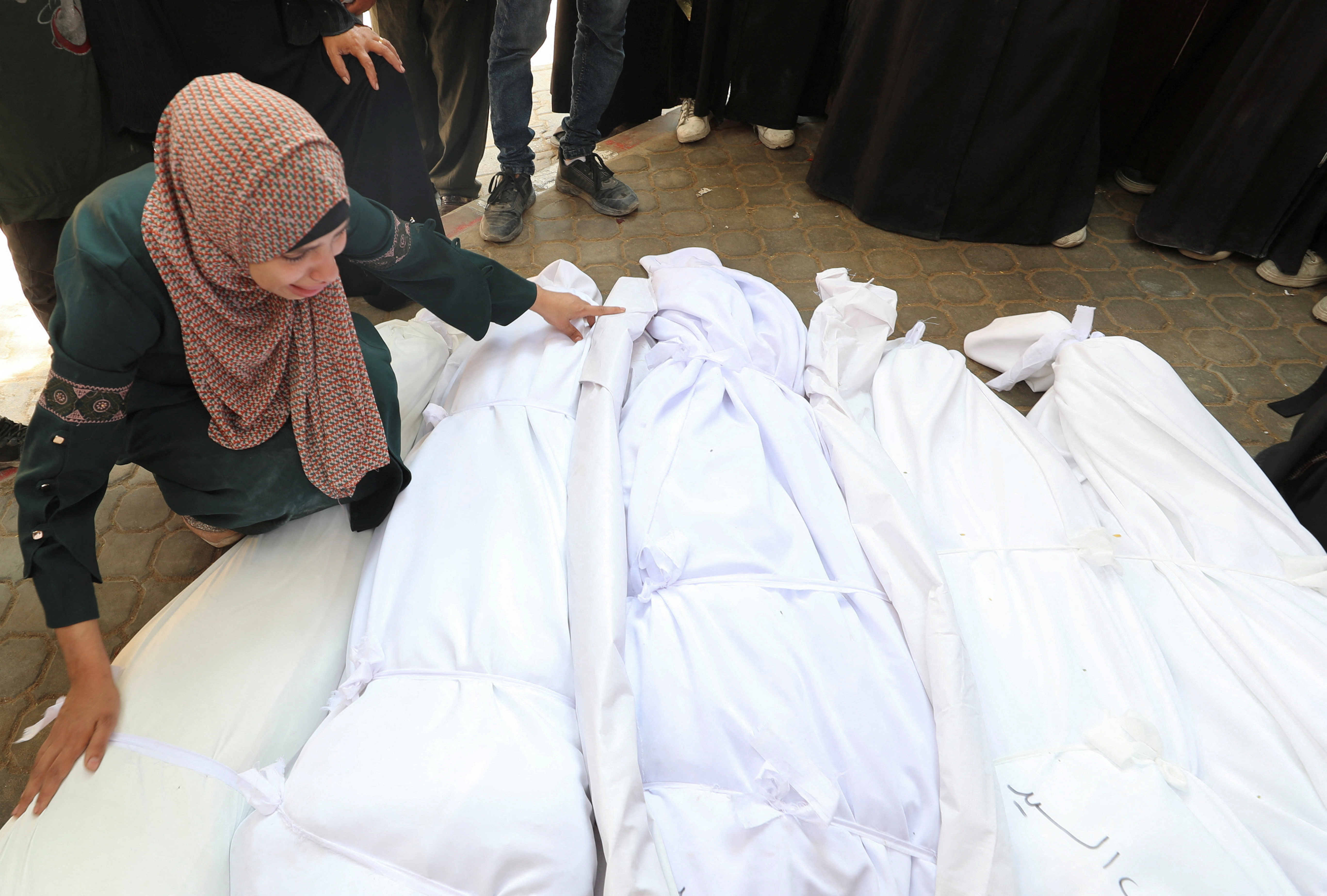 A mourner reacts during the funeral of Palestinians who were killed, according to medics, in Israeli strikes, at Al-Shifa hospital, in Gaza City, June 7, 2025.