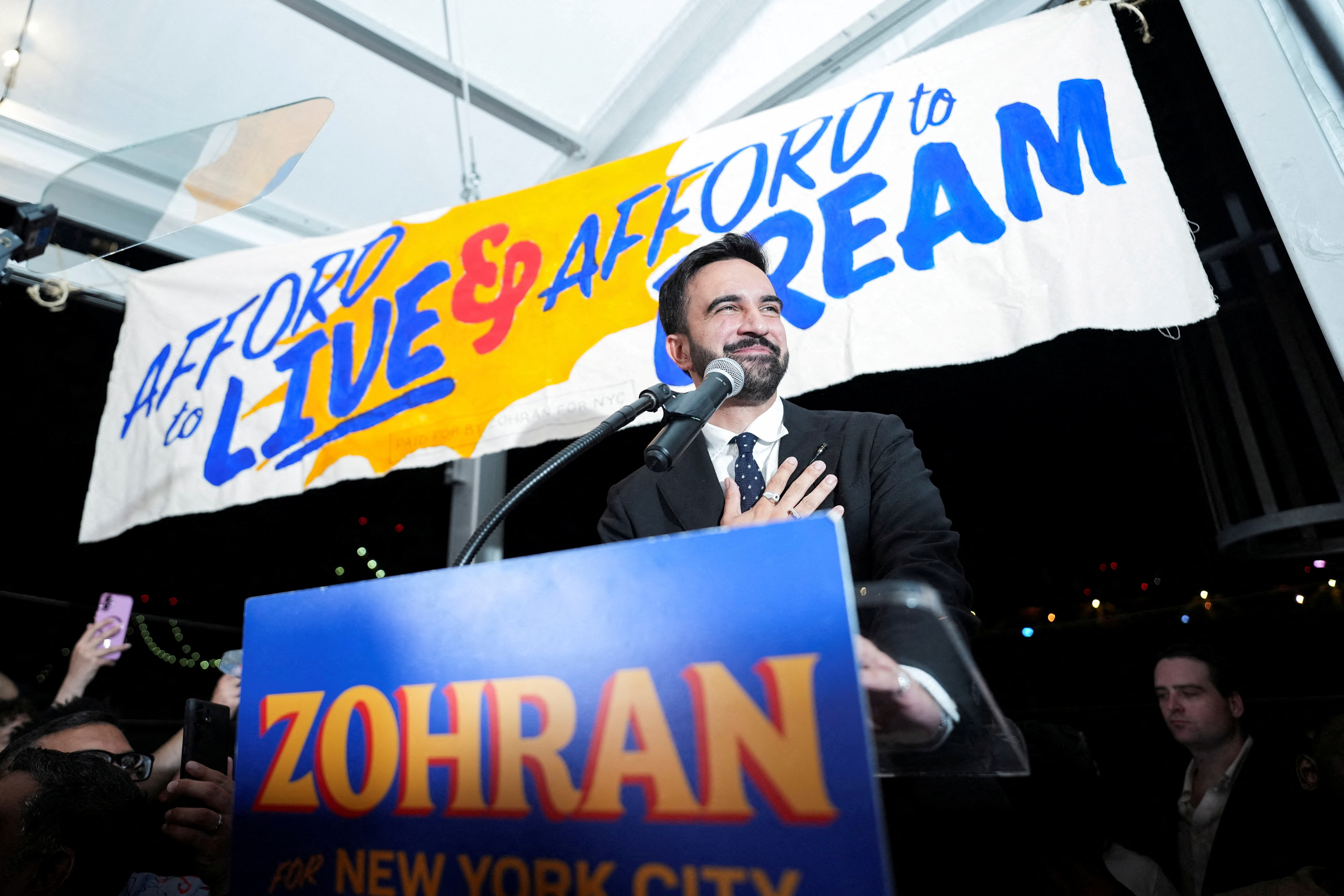 Zohran Mamdani gestures as he speaks during a watch party for his primary election.