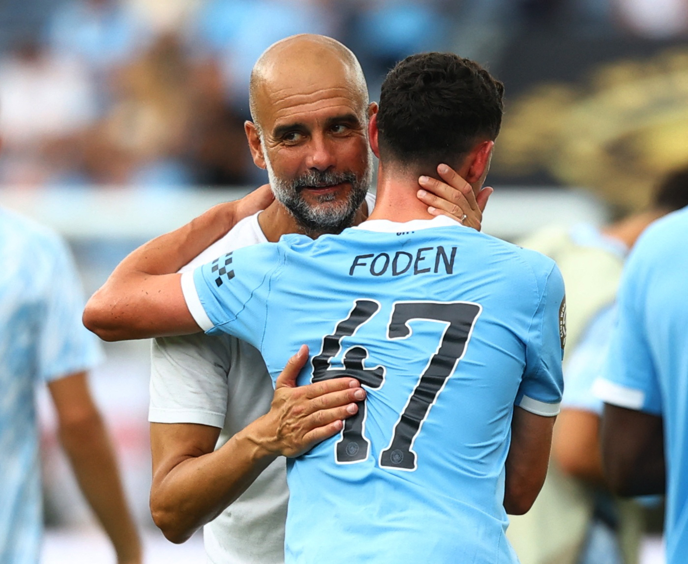 FIFA Club World Cup - Group G - Juventus v Manchester City - Camping World Stadium, Orlando, Florida, U.S. - June 26, 2025 Manchester City manager Pep Guardiola celebrates with Phil Foden