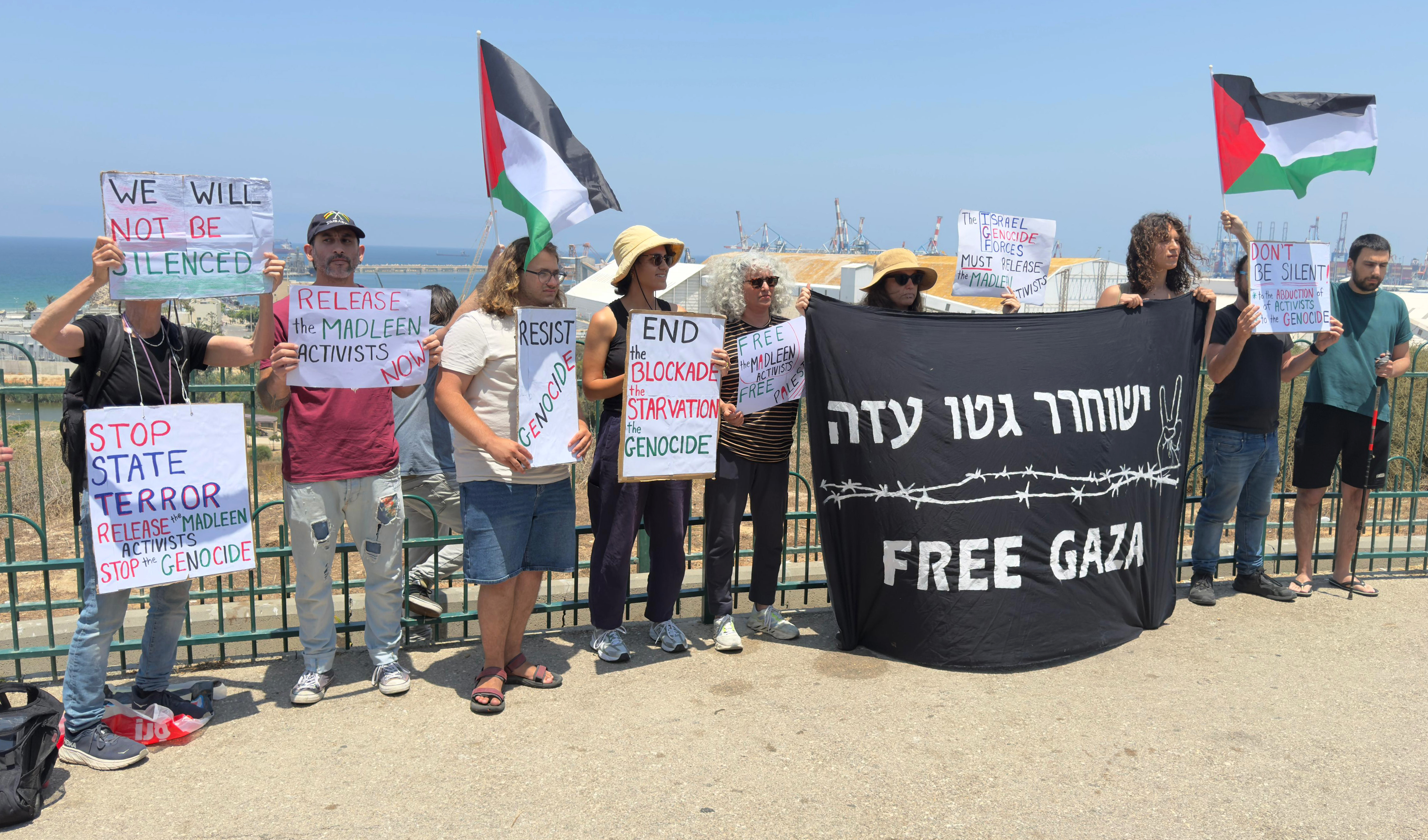 ASHDOD, ISRAEL - JUNE 09: A group of Israeli and foreign activists gather at Port of Ashdod, where the 'Madleen,' a sailboat belonging to the Freedom Flotilla Coalition (FFC), was expected to dock in Israel on June 9, 2025. The activists, carrying Palestinian flags, demand the lifting of Israeli attacks and the blockade on Gaza. The boat, which set out to break the blockade and deliver humanitarian aid to Palestinians suffering from hunger under Israeli attacks, was intercepted by Israeli naval commandos in the Mediterranean. ( Samir Abdalhade - Anadolu Agency )