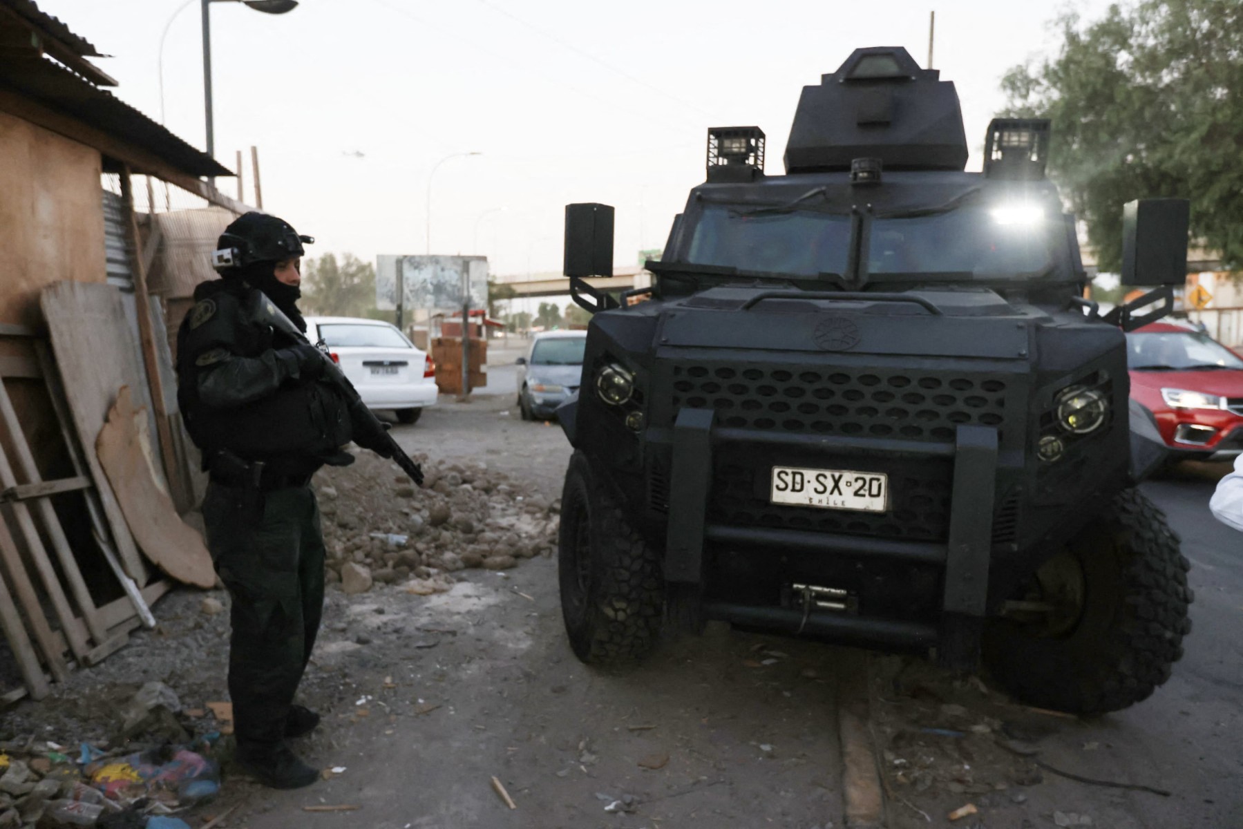 A handout picture released by the Investigations Police of Chile shows a police operation carried out to dismantle a cell of the Venezuelan criminal gang Tren de Aragua on January 22, 2025. [AFP/Investigations Police of Chile/Handout]