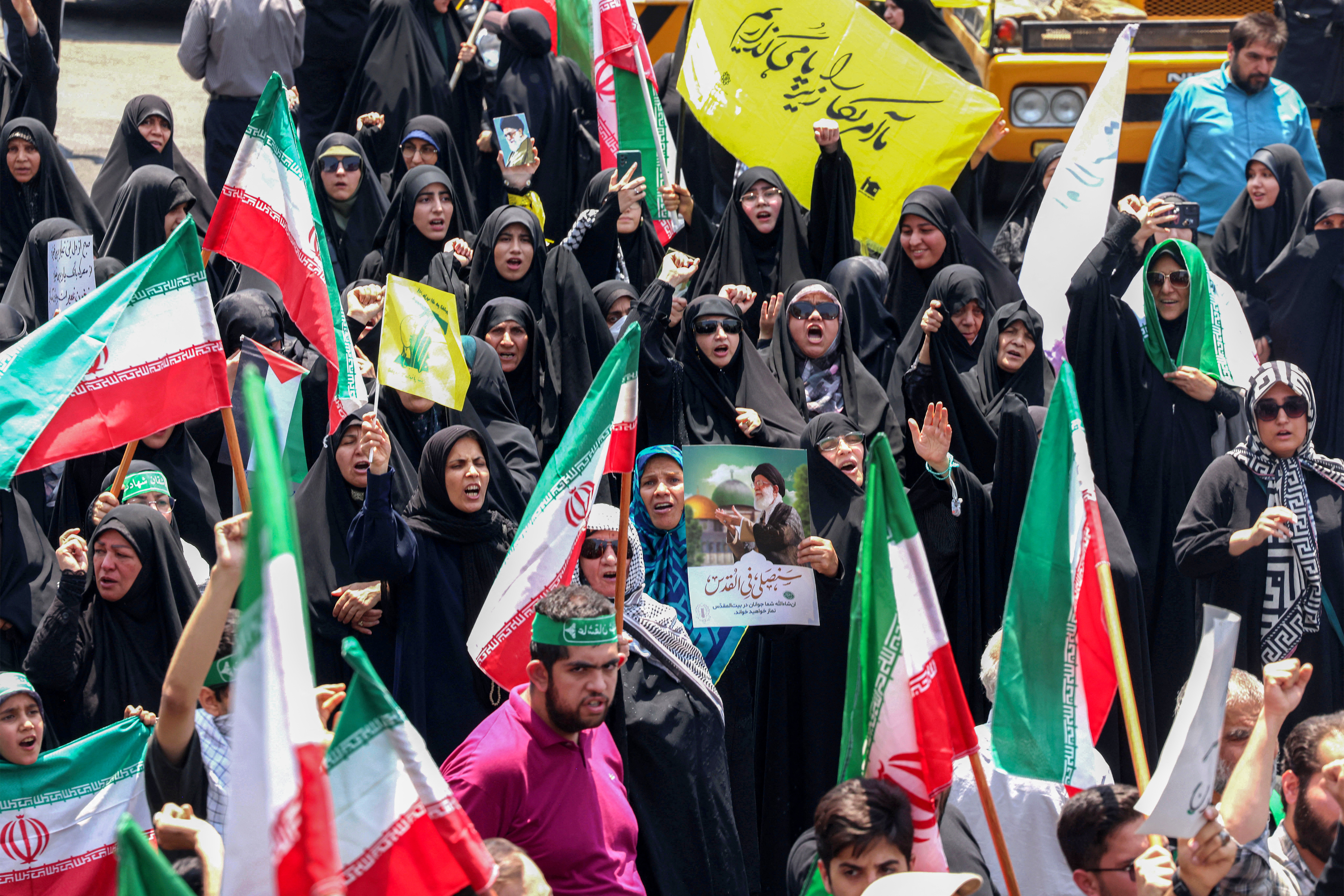People gather for a protest against Israel's wave of strikes on Iran in central Tehran on June 13, 2025.