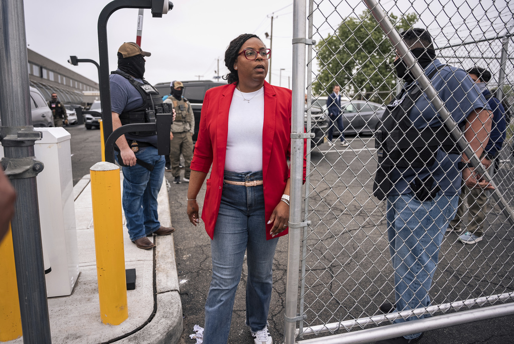 A US Congresswoman exits an ICE facility