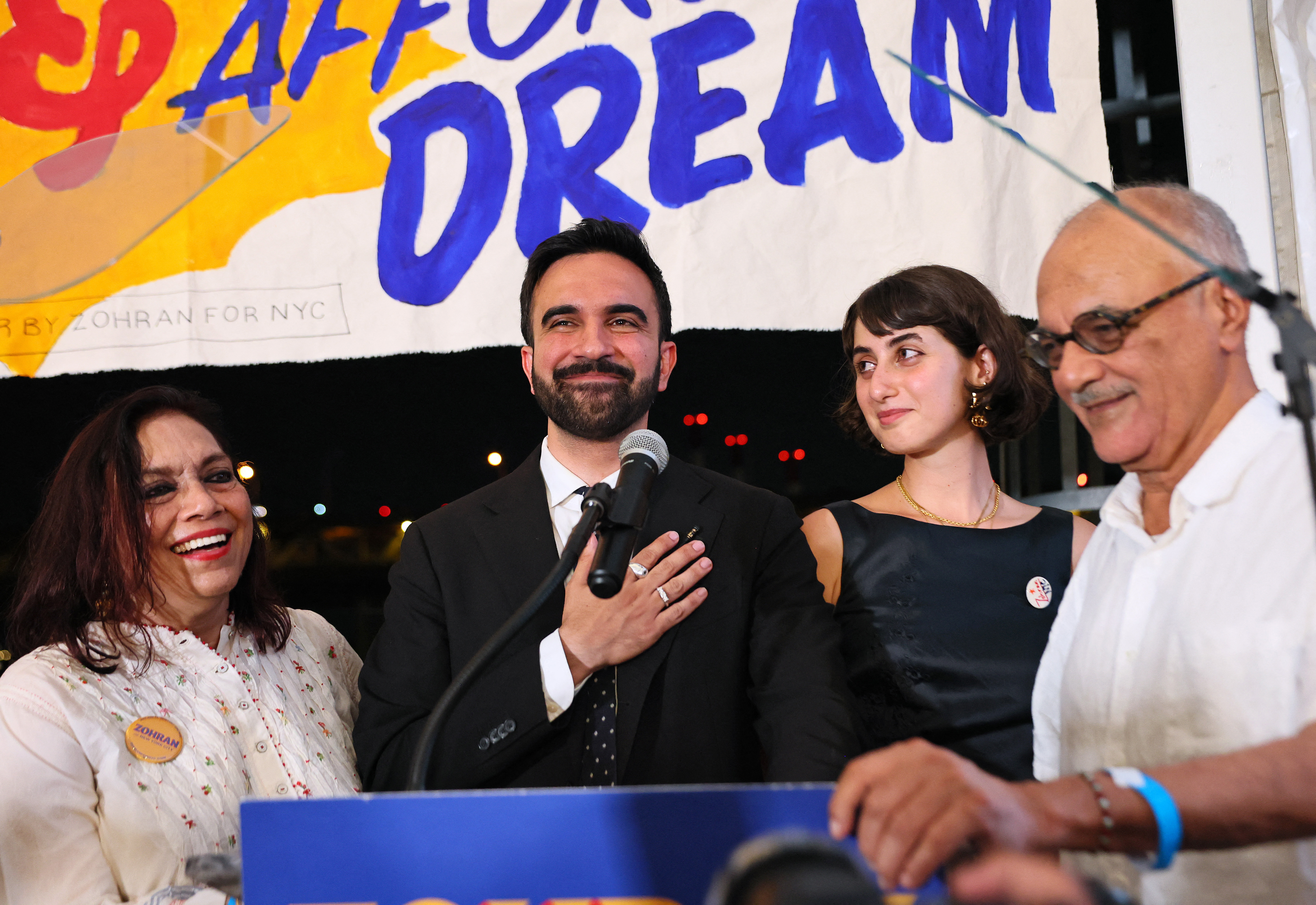 NEW YORK, NEW YORK - JUNE 24: (L-R) Mira Nair, New York mayoral candidate, State Rep. Zohran Mamdani (D-NY) Rama Duwaji and Mahmood Mamdani celebrate on stage during an election night gathering at The Greats of Craft LIC on June 24, 2025 in the Long Island City neighborhood of the Queens borough in New York City. Mamdani was announced as the winner of the Democratic nomination for mayor in a crowded field in the City’s mayoral primary to choose a successor to Mayor Eric Adams, who is running for re-election on an independent ticket. Michael M. Santiago/Getty Images/AFP (Photo by Michael M. Santiago / GETTY IMAGES NORTH AMERICA / Getty Images via AFP)