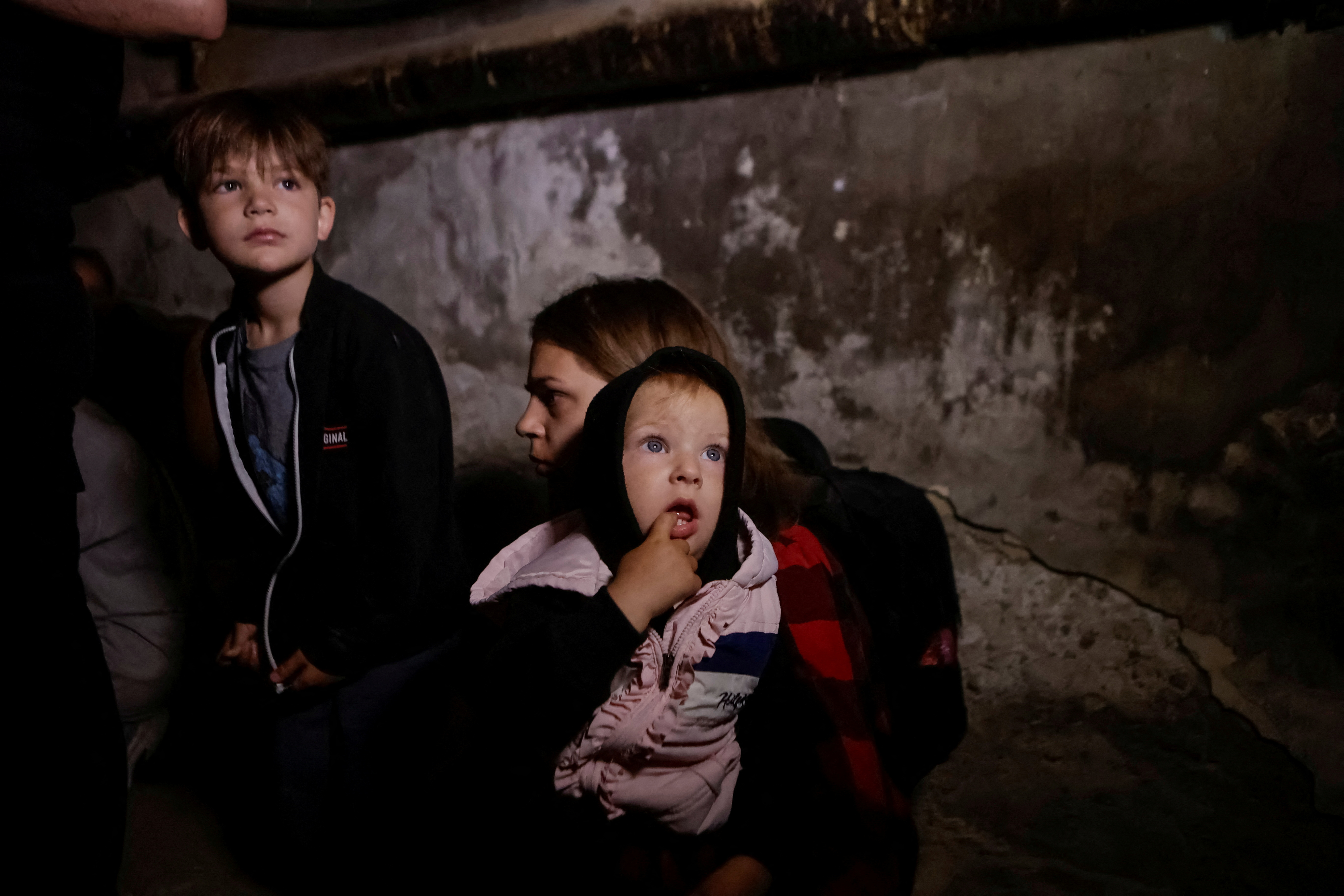Residents take shelter in the basement of their apartment building during a Russian drone strike, amid Russia's attack on Ukraine, in Kharkiv, Ukraine July 7, 2025. REUTERS/Sofiia Gatilova TPX IMAGES OF THE DAY