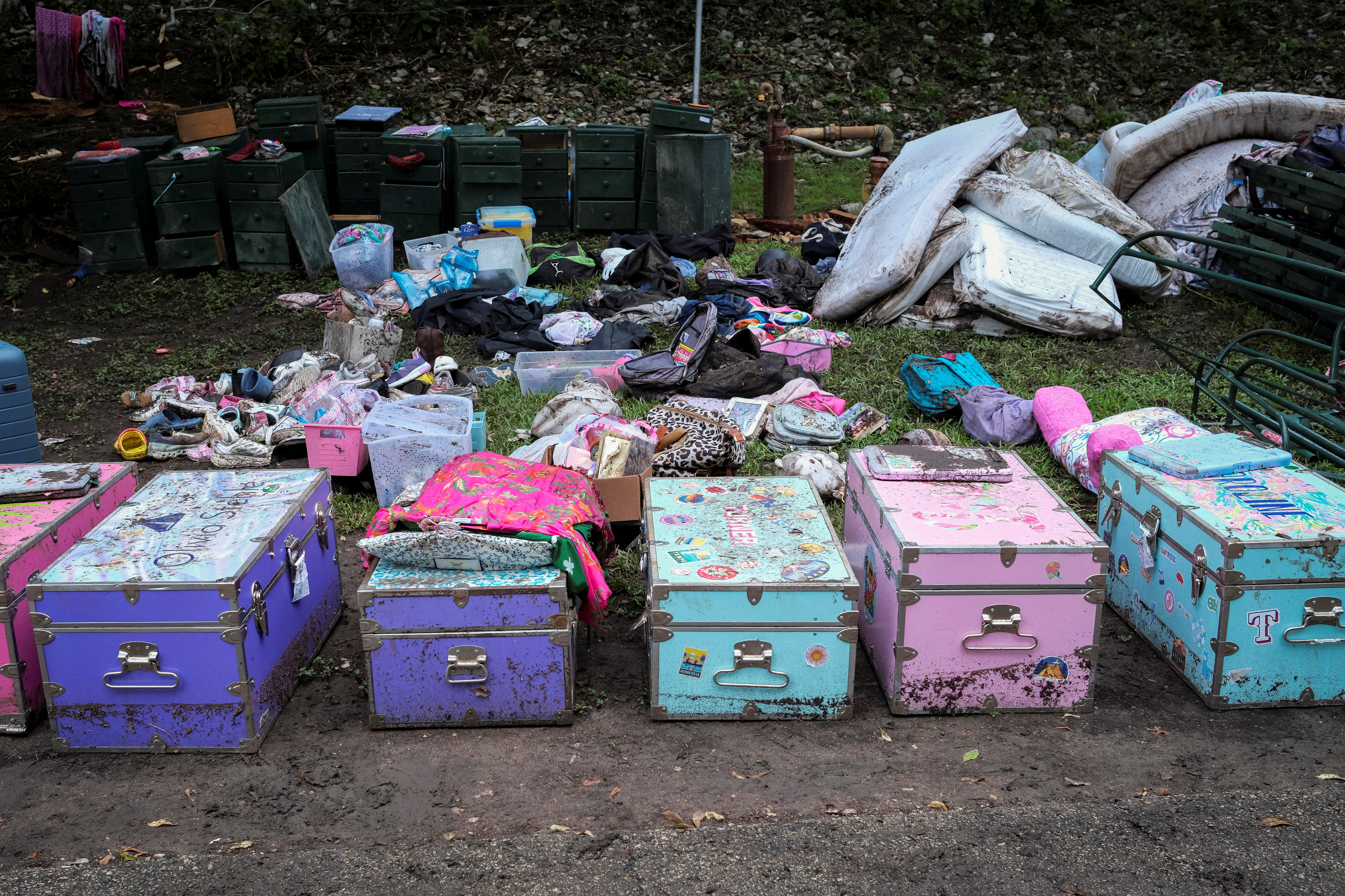 Campers' belongings lie on the ground following flooding on the Guadalupe River, at Camp Mystic, Hunt, Texas, July 7, 2025. [Marco Bello/Reuters]